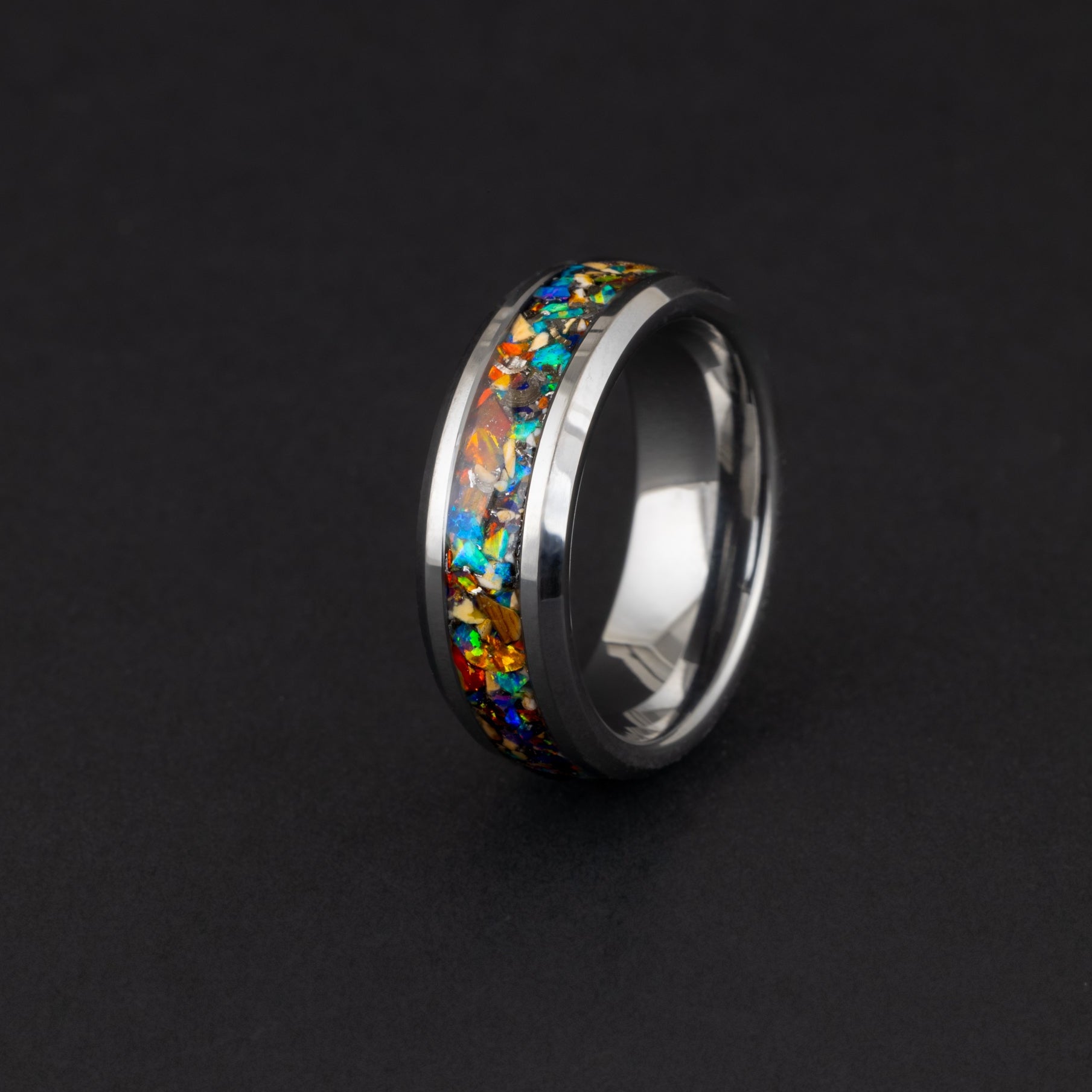 Mosasaur bone and meteorite men's wedding band with rainbow opal inlay.