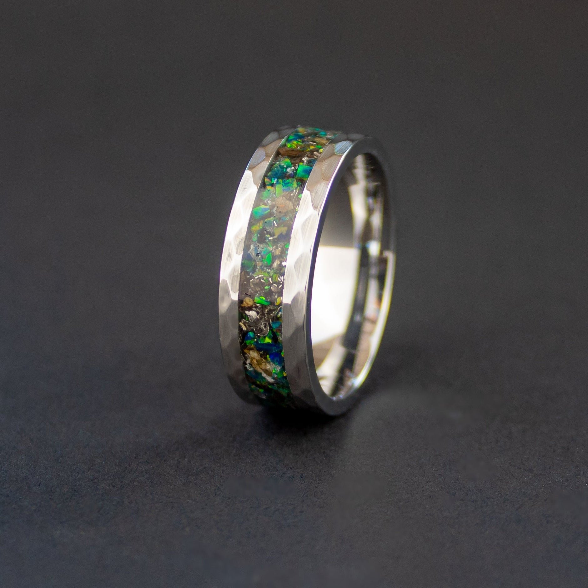 Hammered tungsten ring with authentic T-Rex bone and Campo del Cielo meteorite in green opal inlay