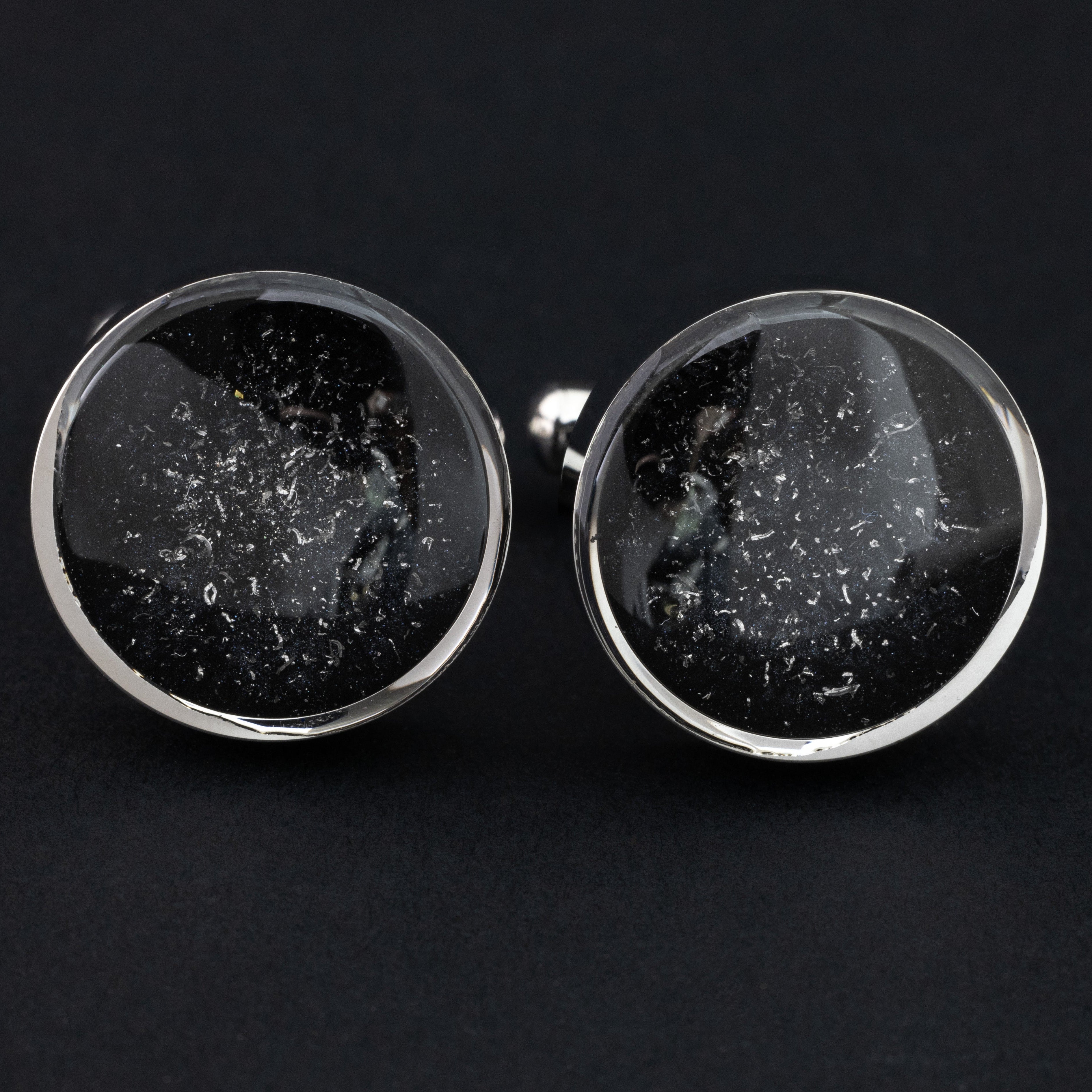 Close-up of the Black Meteorite Cufflinks showing Campo Del Cielo iron meteorite set in deep black resin in polished silver-tone stainless steel