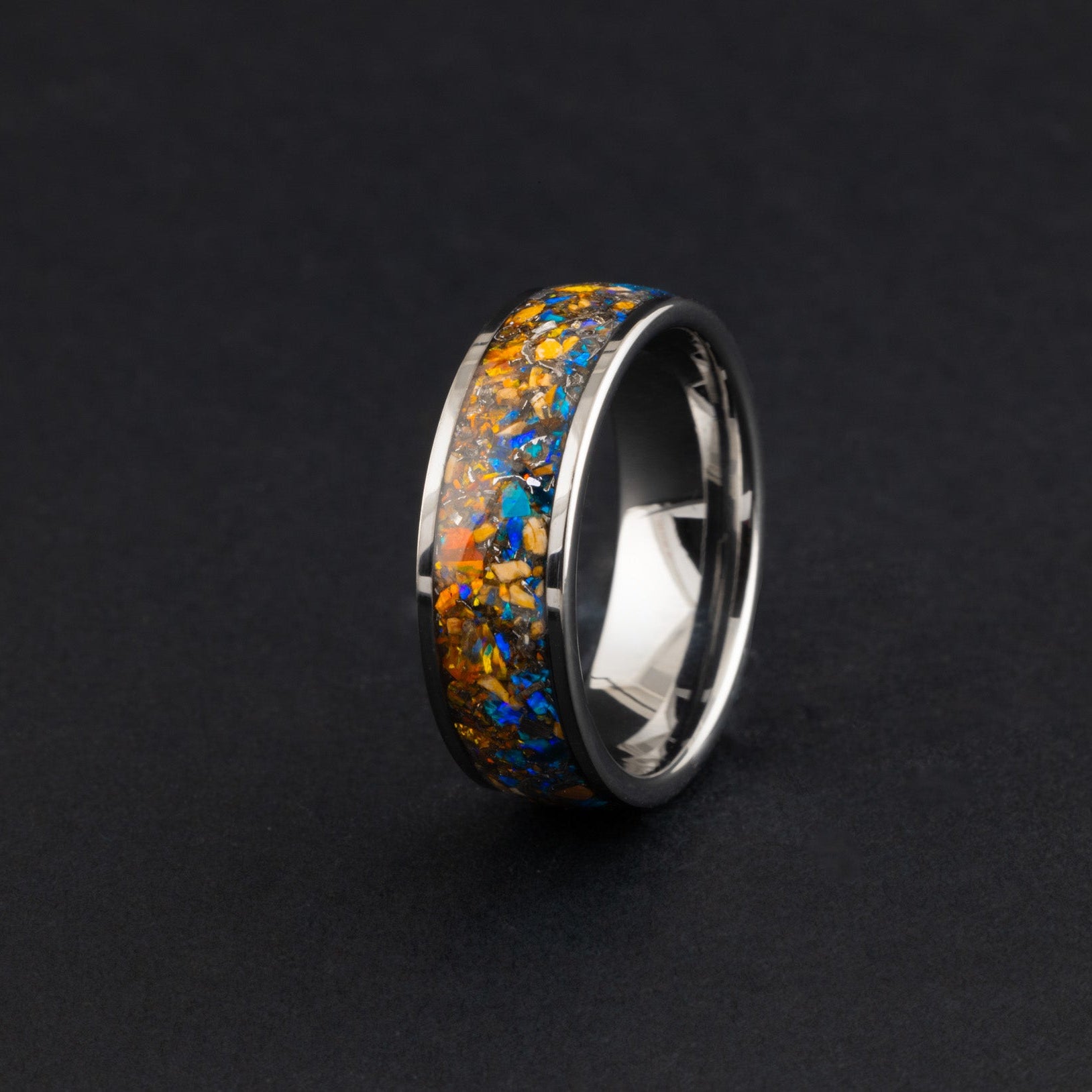 8mm silver tungsten channel ring with blue and orange fire opal and meteorite.
