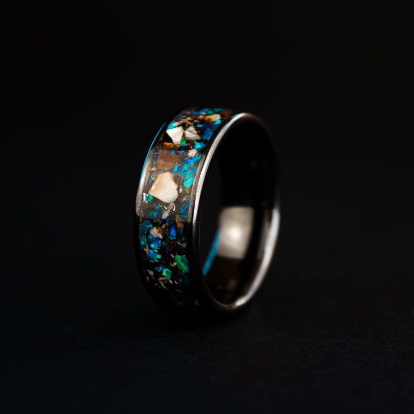 8mm wide channel black ceramic ring with authentic Mosasaur bone, Dinosaur Gembone, and Campo del Cielo meteorite in blue opal inlay