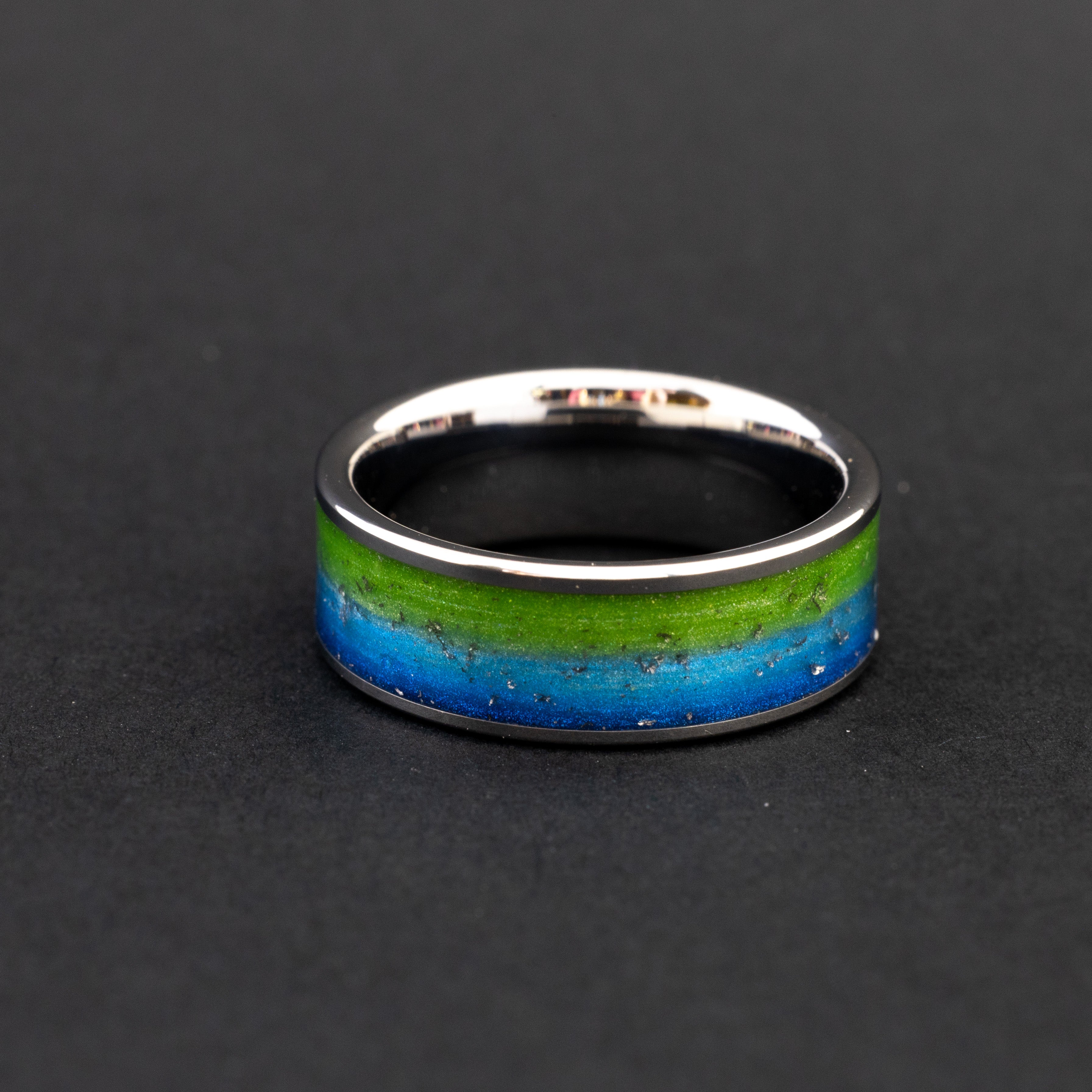 Handcrafted tungsten wedding band featuring celestial Gibeon fragments and dual-colored inlay.