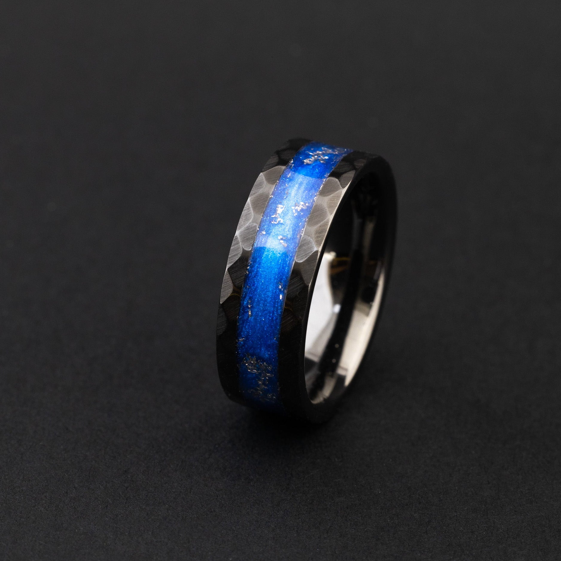 Hammered black ceramic ring with authentic Campo meteorite and vibrant blue resin inlay.