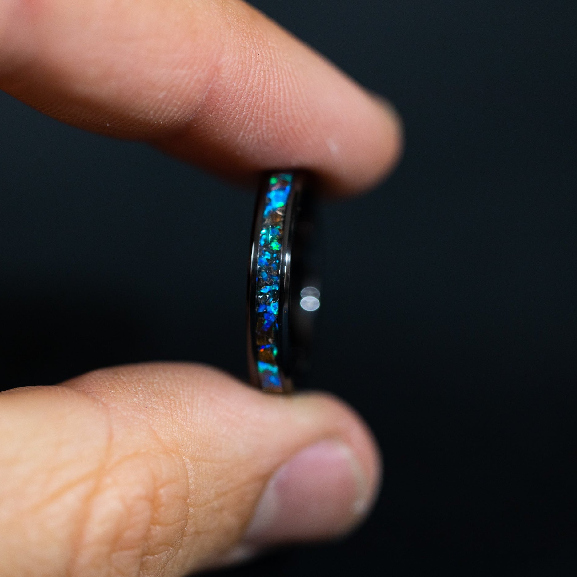 4mm black ceramic wedding band featuring prehistoric T-Rex bone and cobalt blue opal.