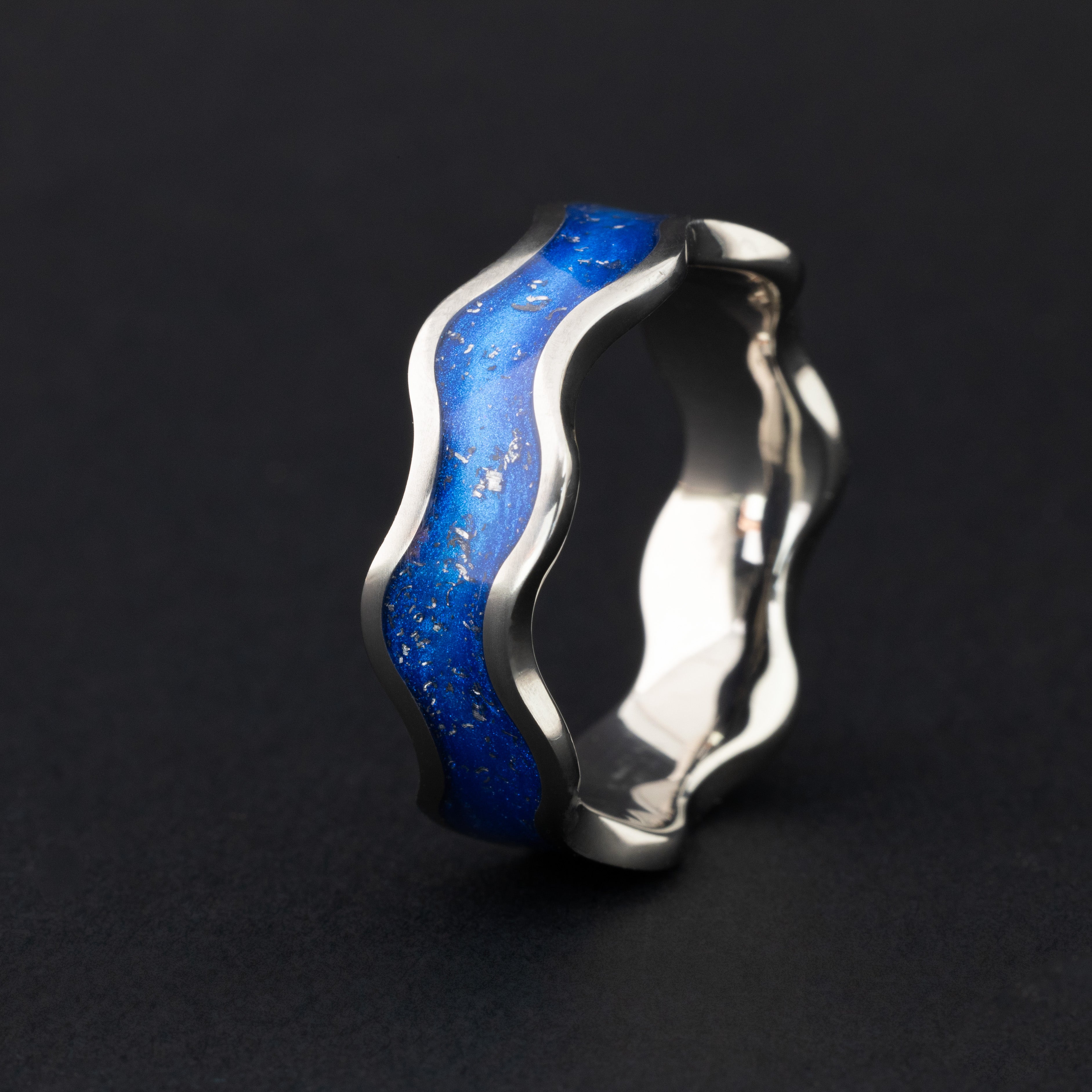 8mm titanium wiggle band ring with wave profile featuring authentic Campo del Cielo meteorite pieces in blue resin inlay
