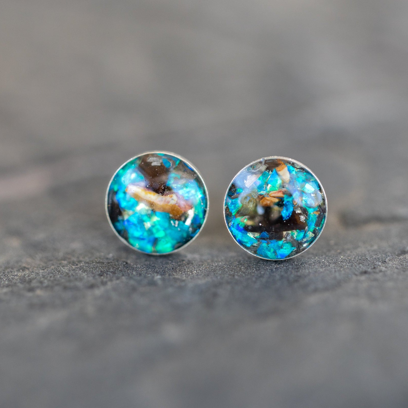 Authentic Campo Del Cielo meteorite and real velociraptor bone stud earrings with blue opal in sterling silver. Handcrafted real dinosaur fossil jewelry from our California studio.