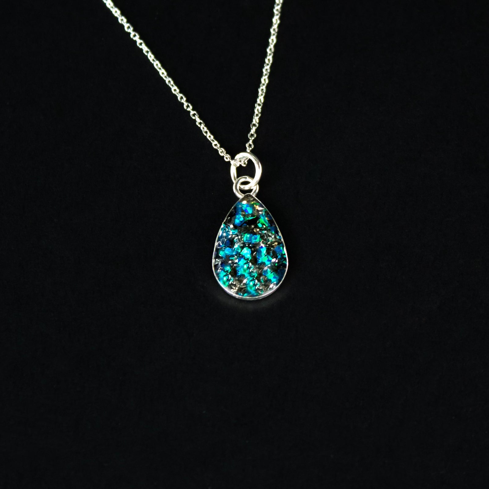Handcrafted blue opal and meteorite teardrop pendant necklace in sterling silver with Campo Del Cielo meteorite and vivid blue opal inlay