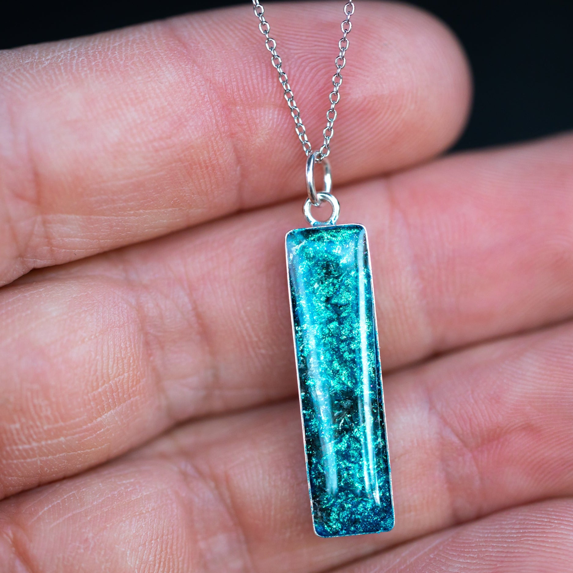Handcrafted blue meteorite bar pendant necklace in sterling silver with Campo Del Cielo meteorite and blue glitter pigment inlay