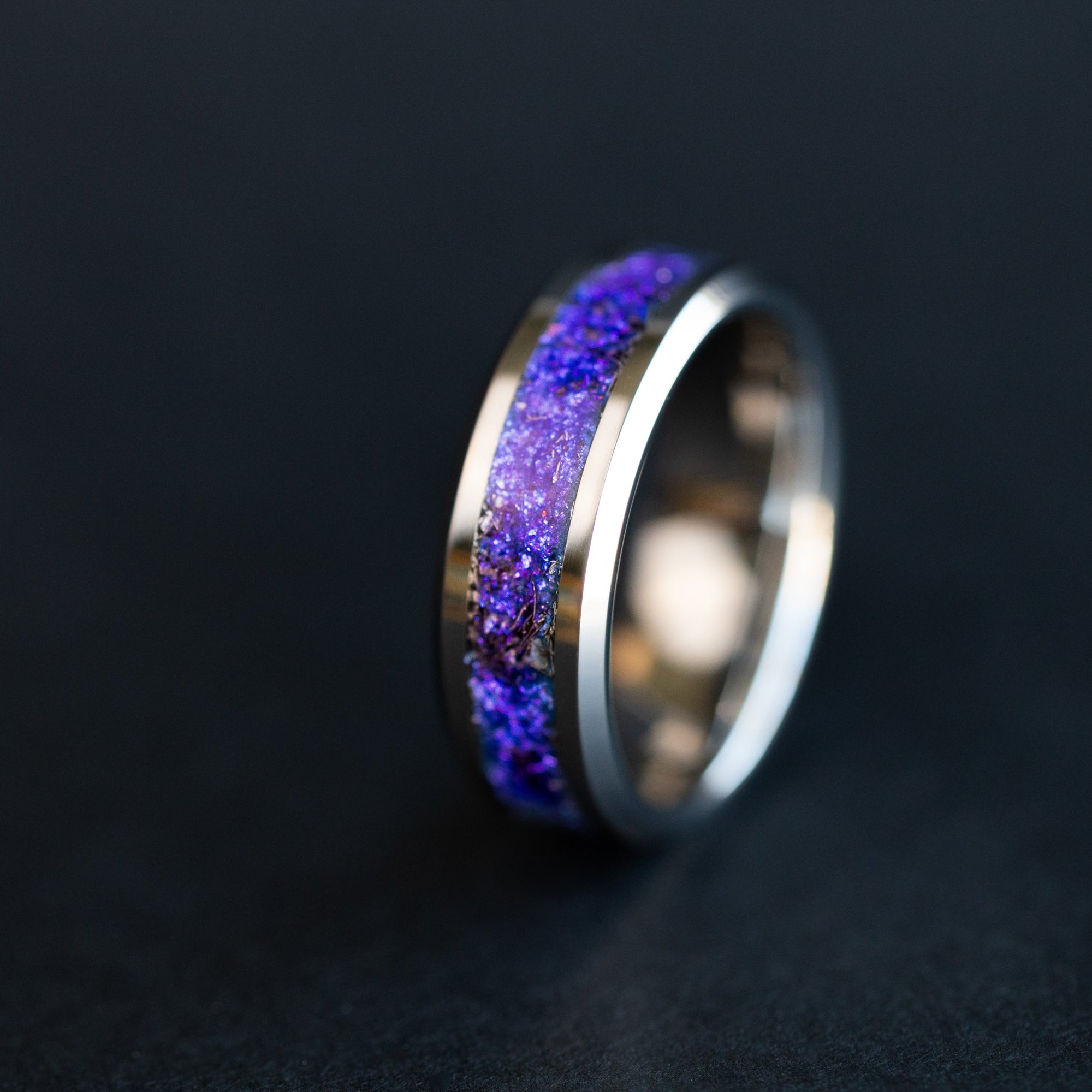 8mm beveled tungsten ring with authentic Campo del Cielo meteorite shavings suspended in deep purple and blue midnight galaxy pigment inlay