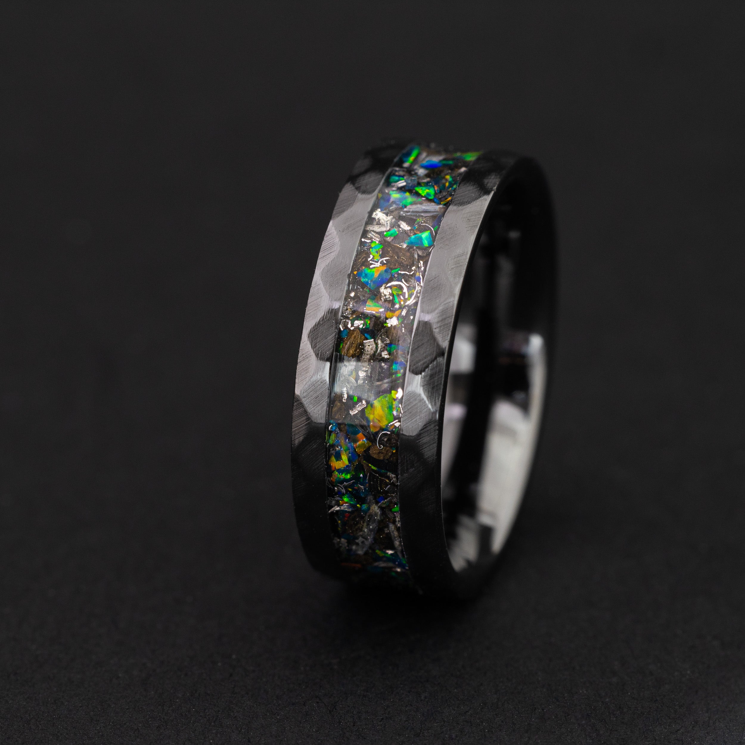 Handcrafted Megalodon tooth and meteorite ring with green fire opal in a hammered black ceramic band.