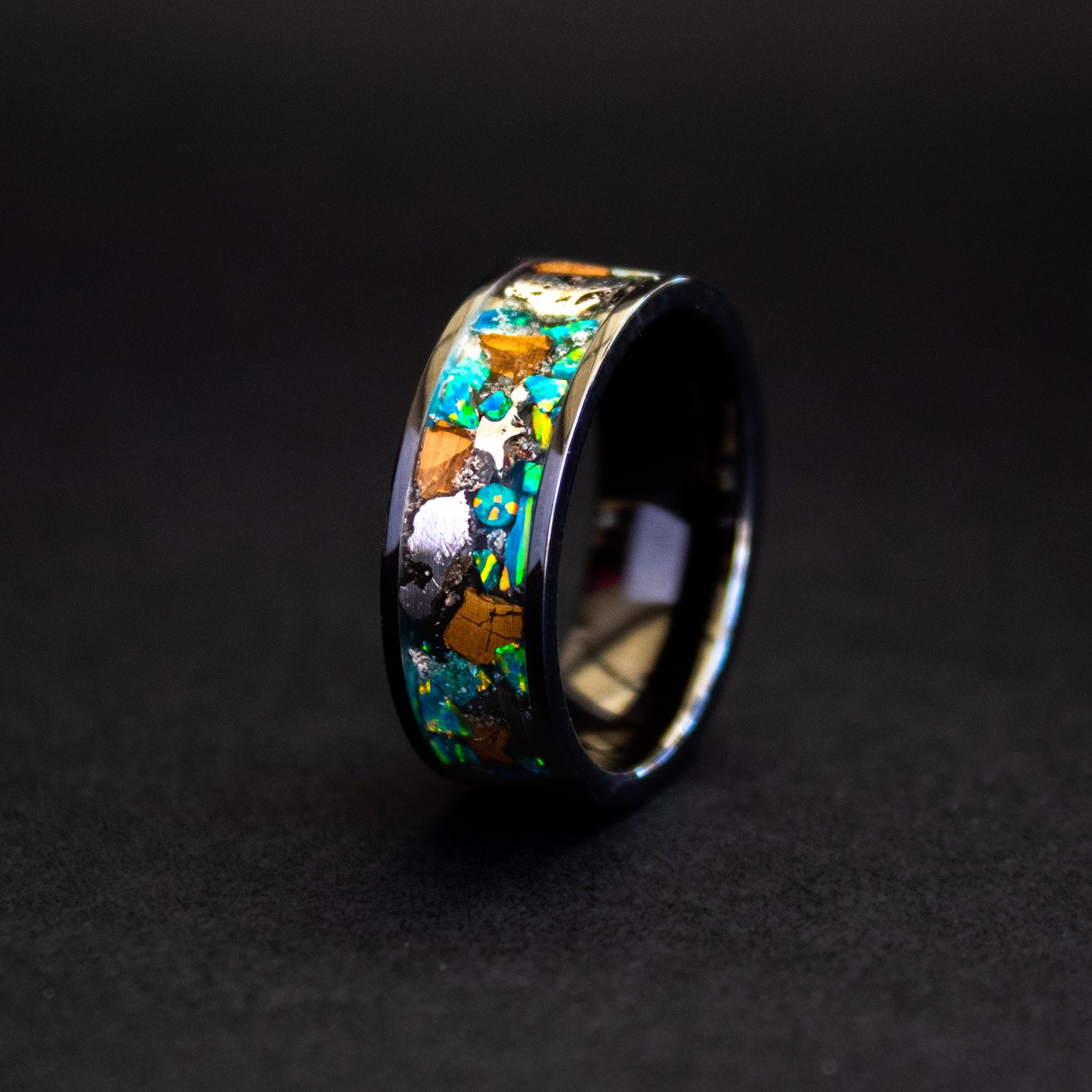 8mm wide channel tungsten ring with large pieces of authentic T-Rex bone and Campo del Cielo meteorite in blue and green opal inlay