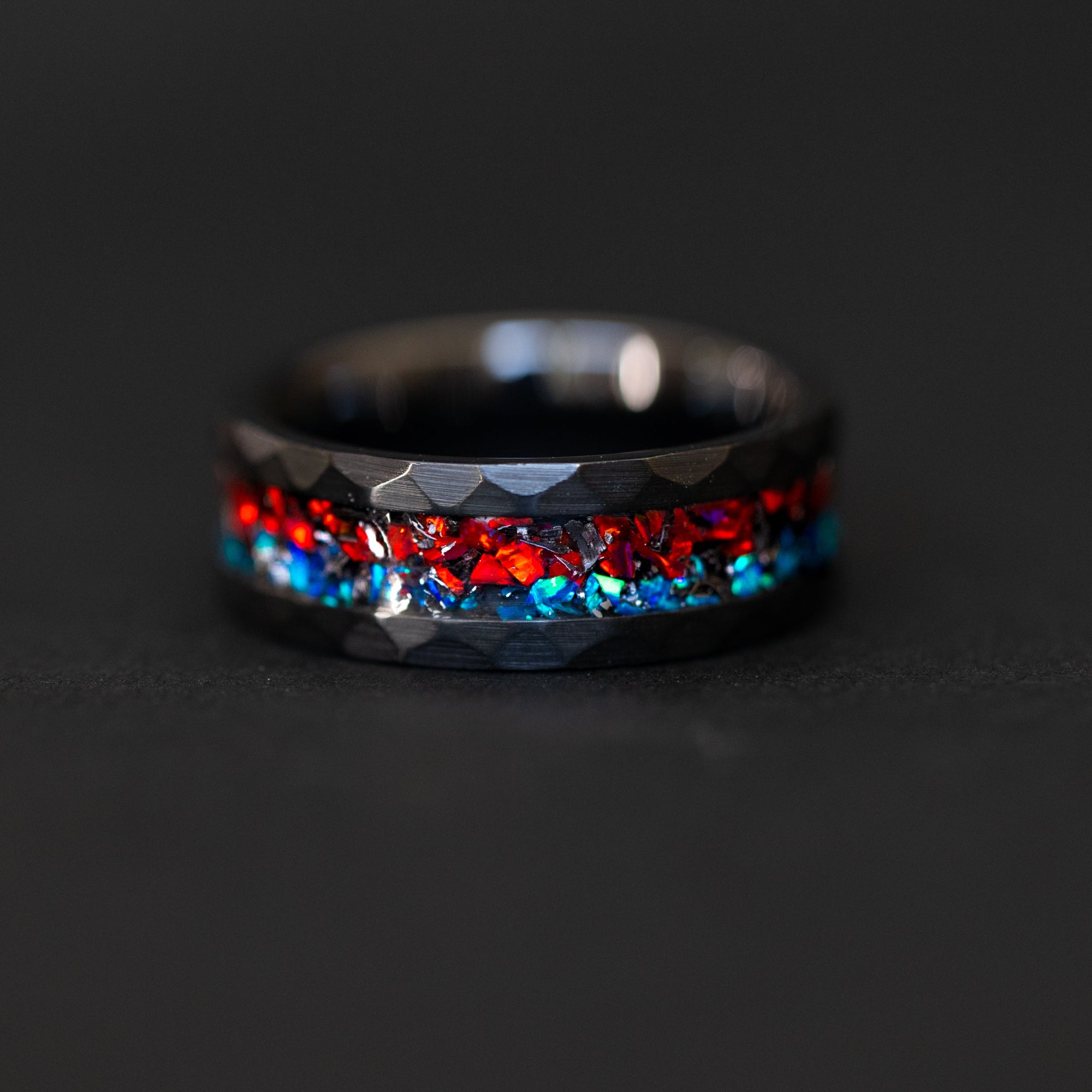 Hammered black ceramic ring with authentic meteorite and split red and blue opal inlay.