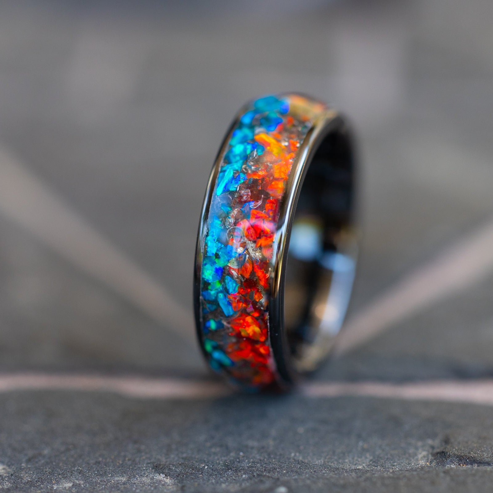 8mm wide channel black ceramic ring with authentic Campo del Cielo meteorite shavings in split red and blue opal inlay