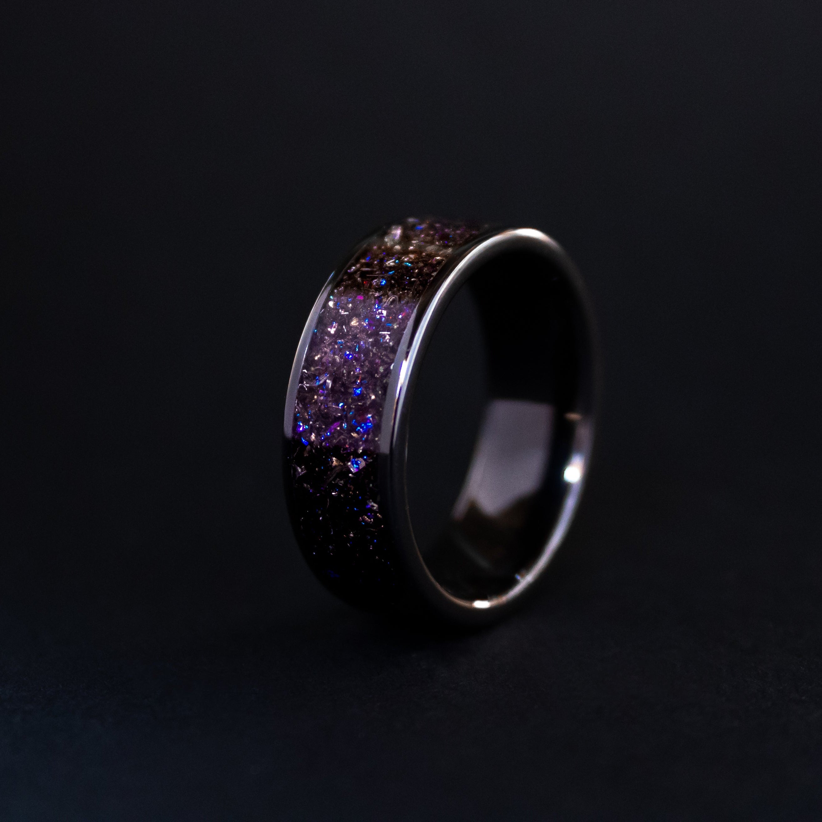 8mm wide channel black ceramic ring with authentic Gibeon meteorite shavings in blue and purple galaxy glitter inlay