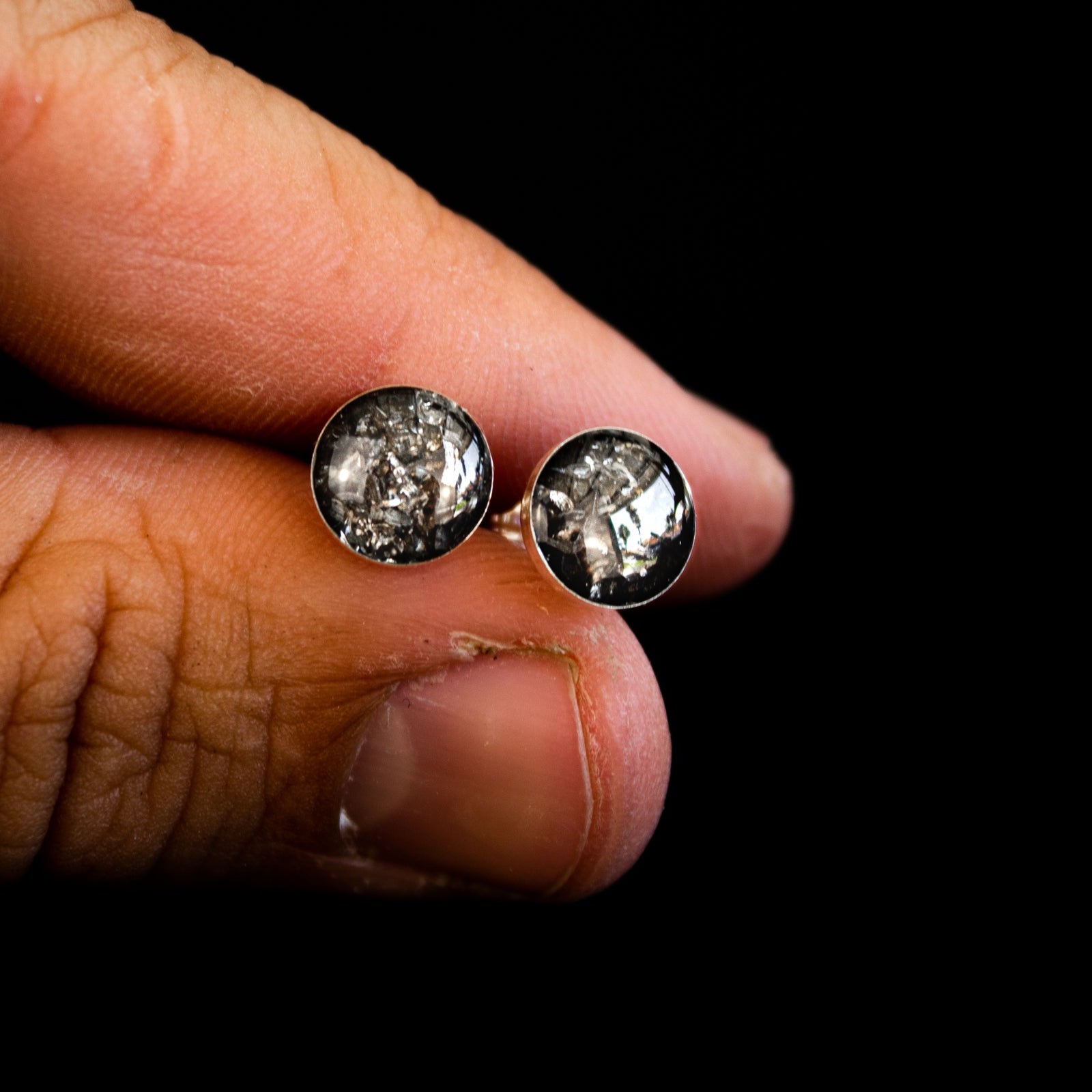 Close-up of the Gibeon Meteorite Earrings showing the natural crystalline pattern of the real iron meteorite in sterling silver