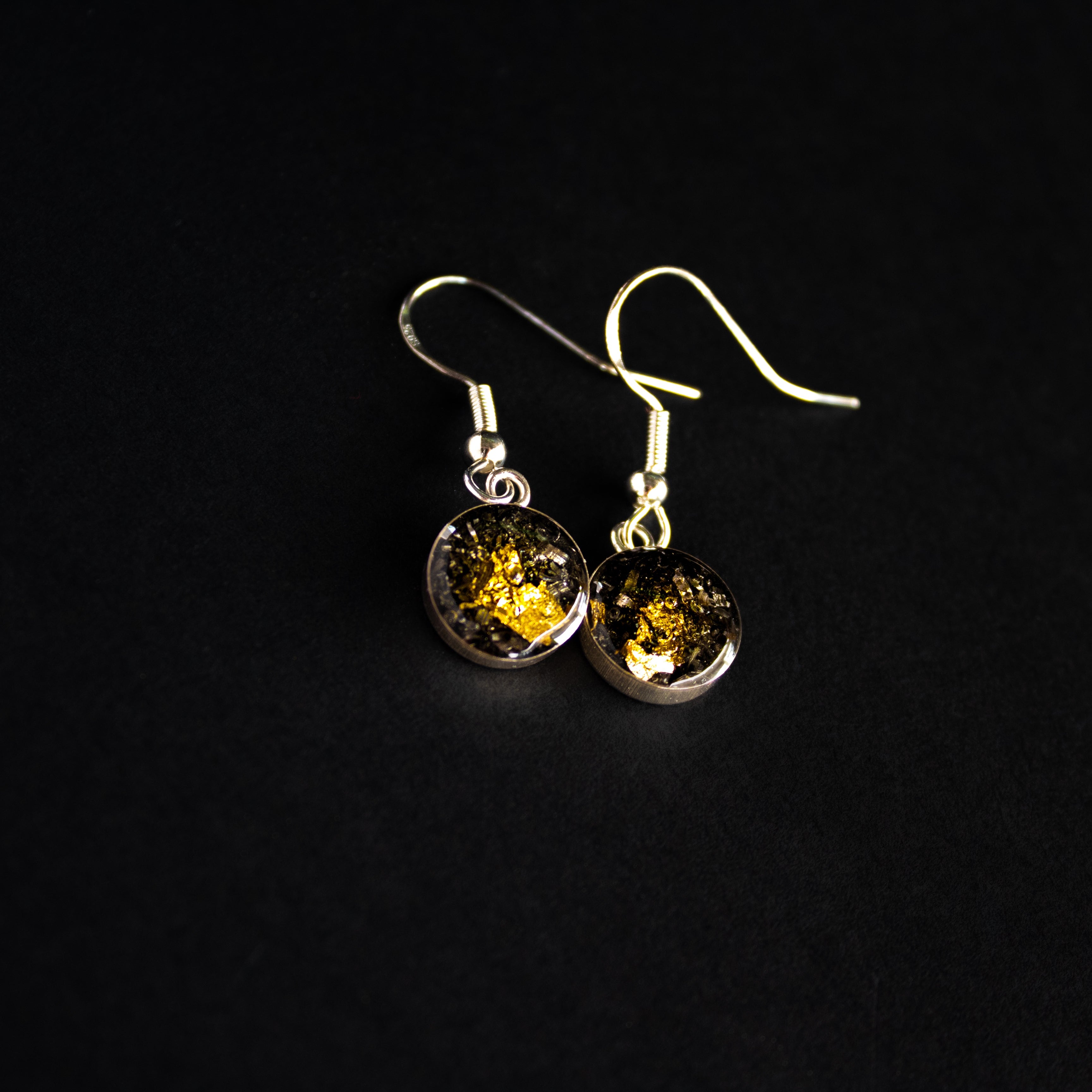 Handcrafted gold and silver dangle earrings in sterling silver with Campo Del Cielo meteorite and gold leaf inlay