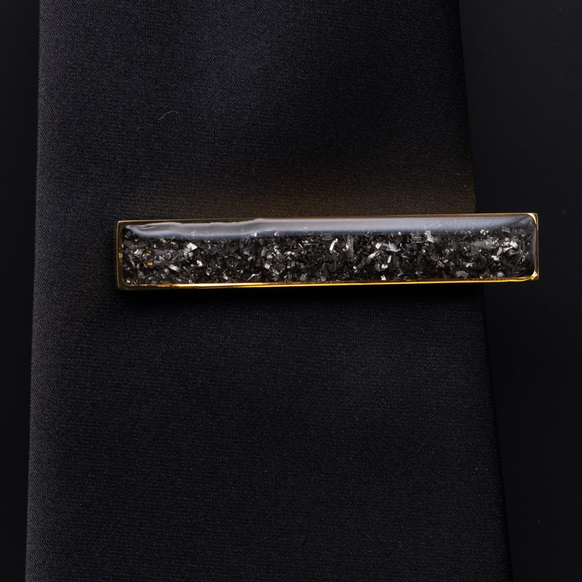 Close-up of the Gold Meteorite Tie Clip showing Campo Del Cielo iron meteorite set in polished gold-tone stainless steel