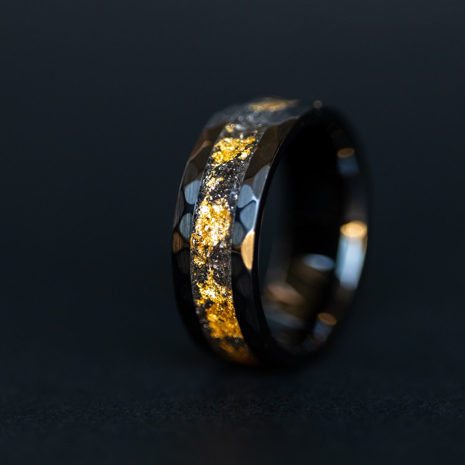 Hammered black ceramic ring with authentic Campo del Cielo meteorite shavings and real gold leaf inlay