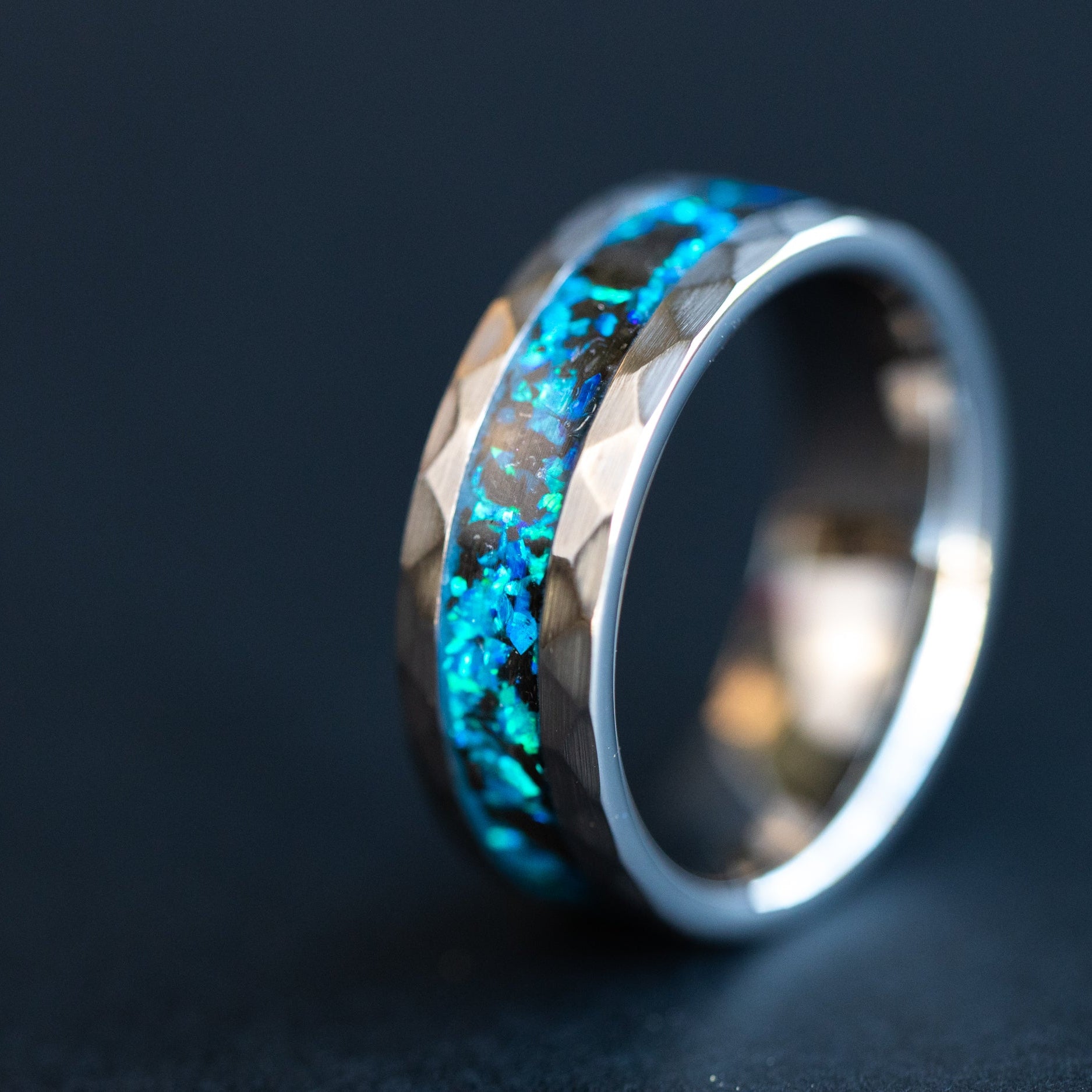 8mm hammered tungsten ring with authentic Megalodon tooth fossil and blue opal inlay glowing blue in the dark