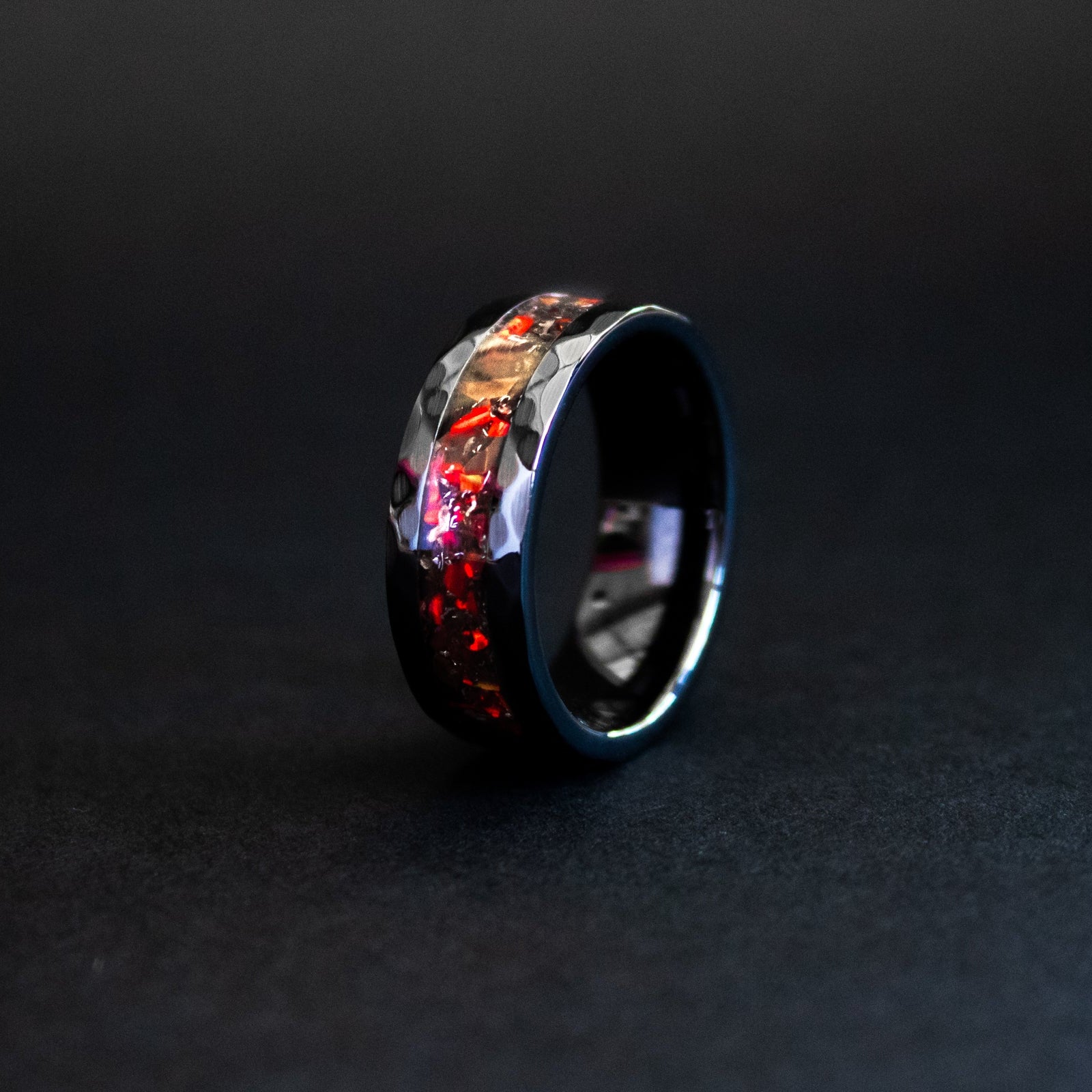 Hammered black ceramic ring with authentic T-Rex bone and Campo del Cielo meteorite in red opal inlay
