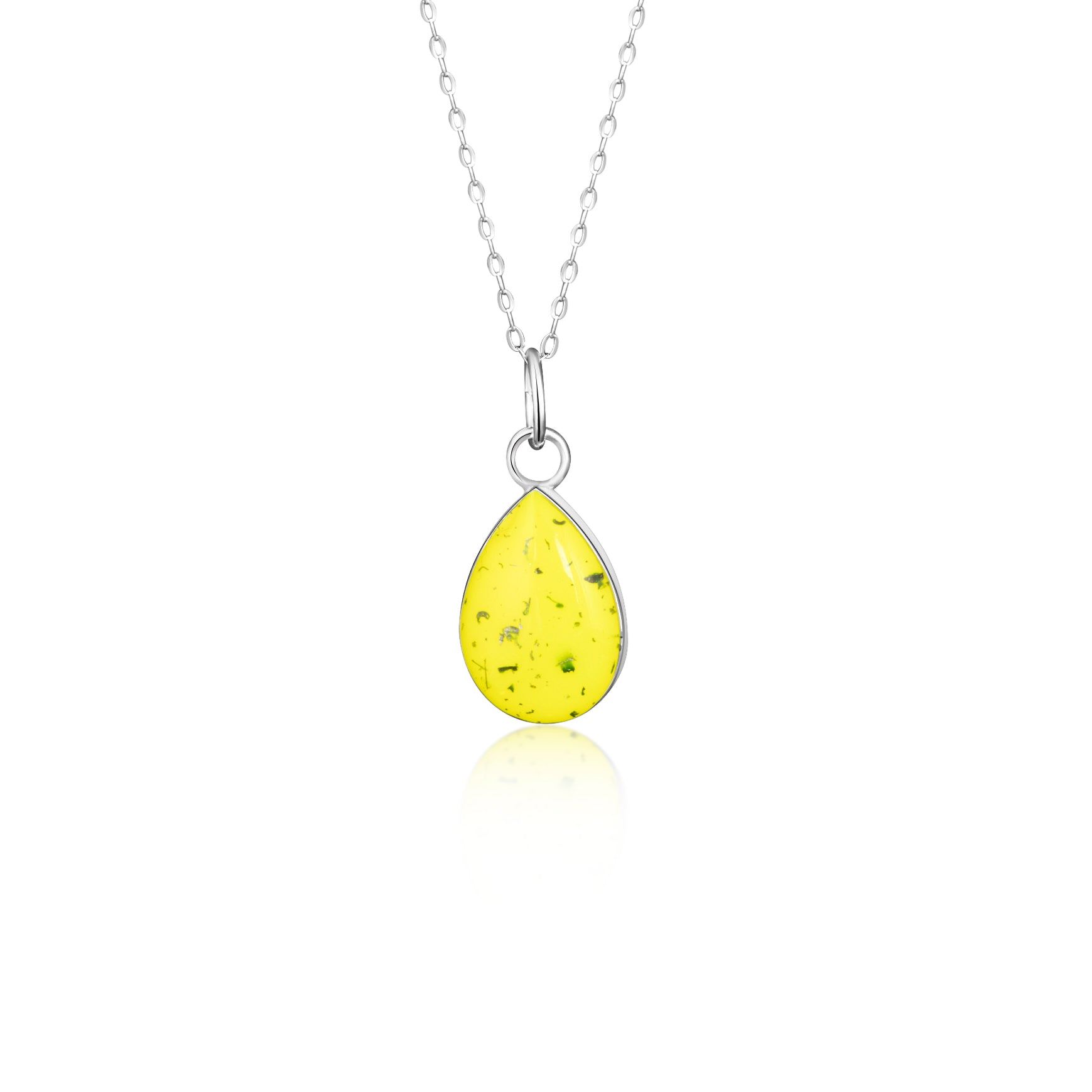 Close-up of the Lemon Drop pendant showing authentic Campo Del Cielo meteorite fragments set in yellow resin