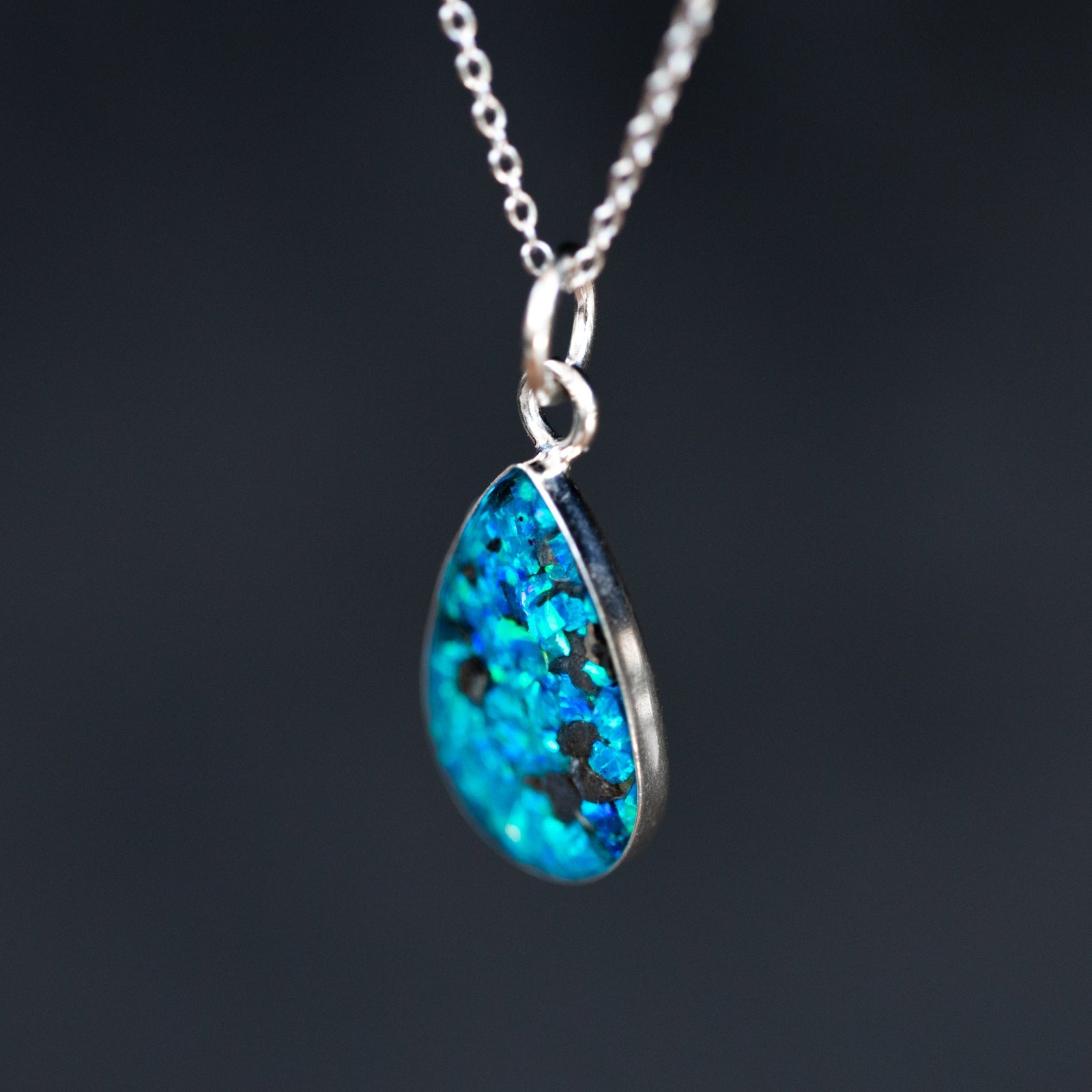 Handcrafted lunar meteorite teardrop pendant necklace in sterling silver with real moon rock and sky blue opal inlay