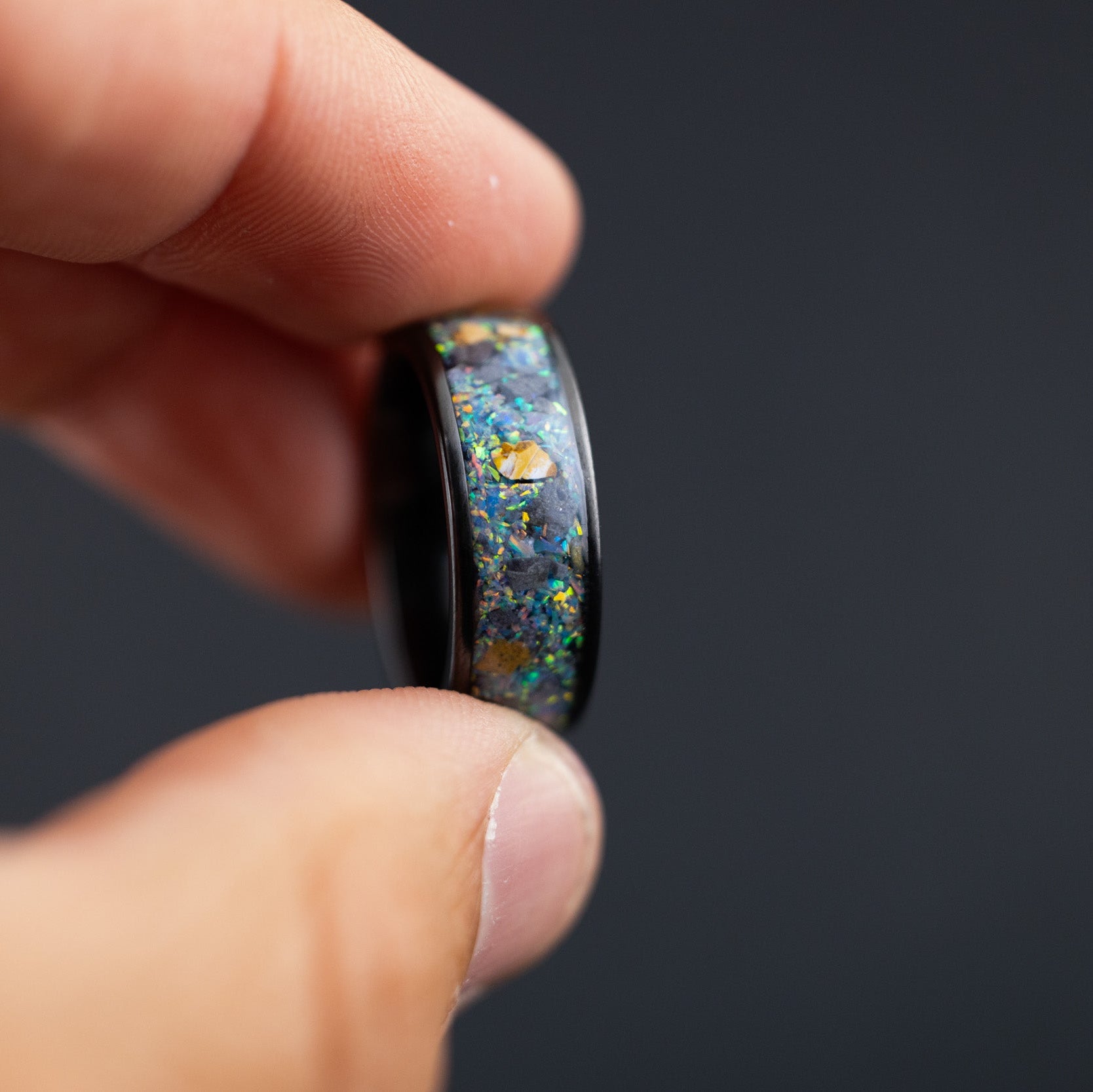 black ceramic wedding band featuring authentic lunar fragments and raptor bone