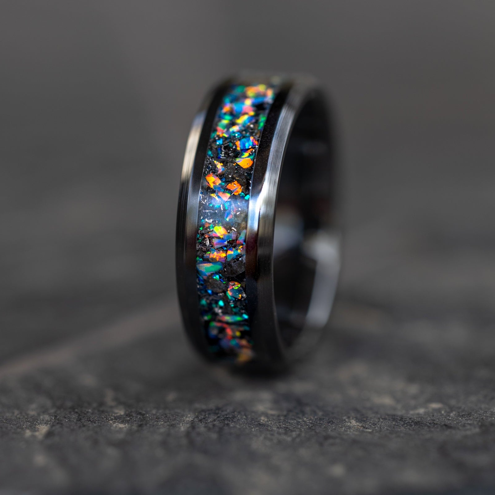 8mm beveled black ceramic ring with authentic lunar meteorite fragments and rainbow moonstone opal inlay