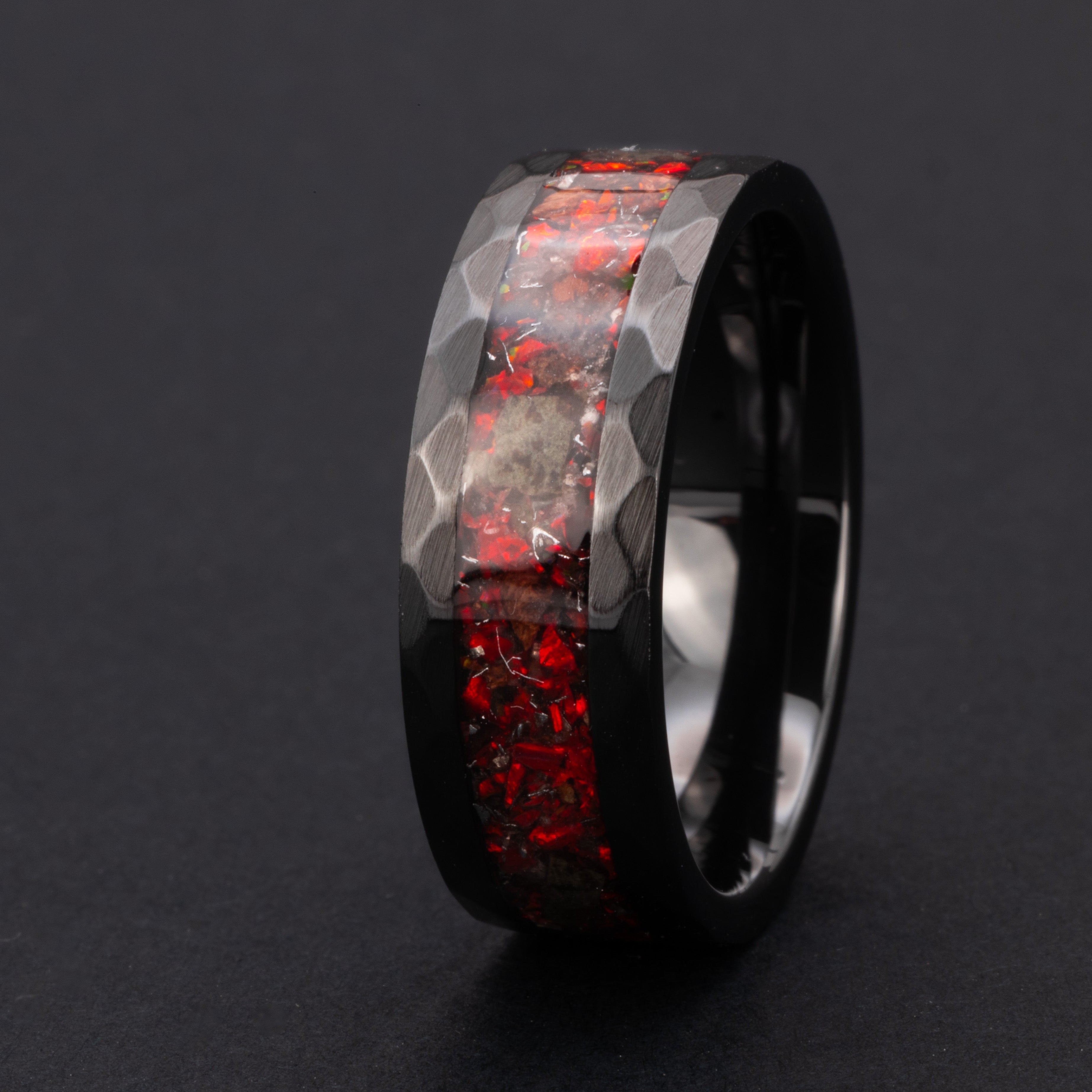 Hammered black ceramic ring with authentic T-Rex bone and Martian meteorite in red opal inlay