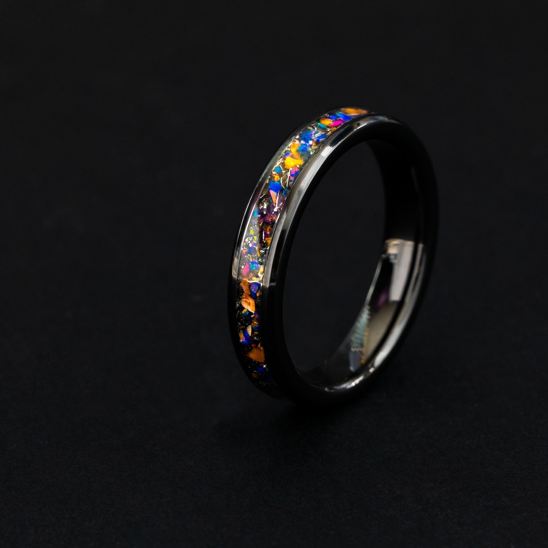 4mm black ceramic ring with authentic Velociraptor bone, meteorite, and purple midnight opal.