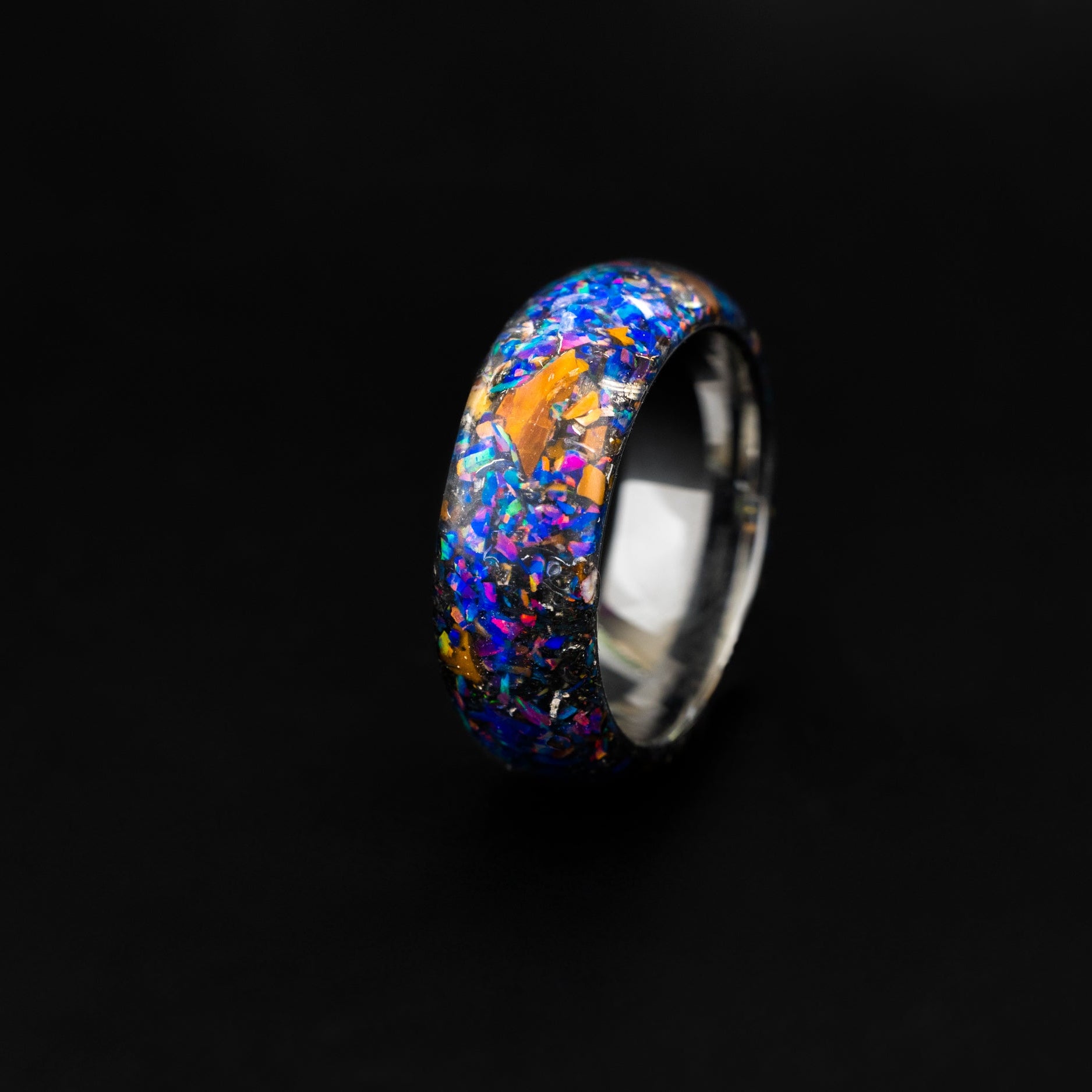 Endless silver tungsten ring with authentic Velociraptor bone, meteorite, and purple midnight opal.