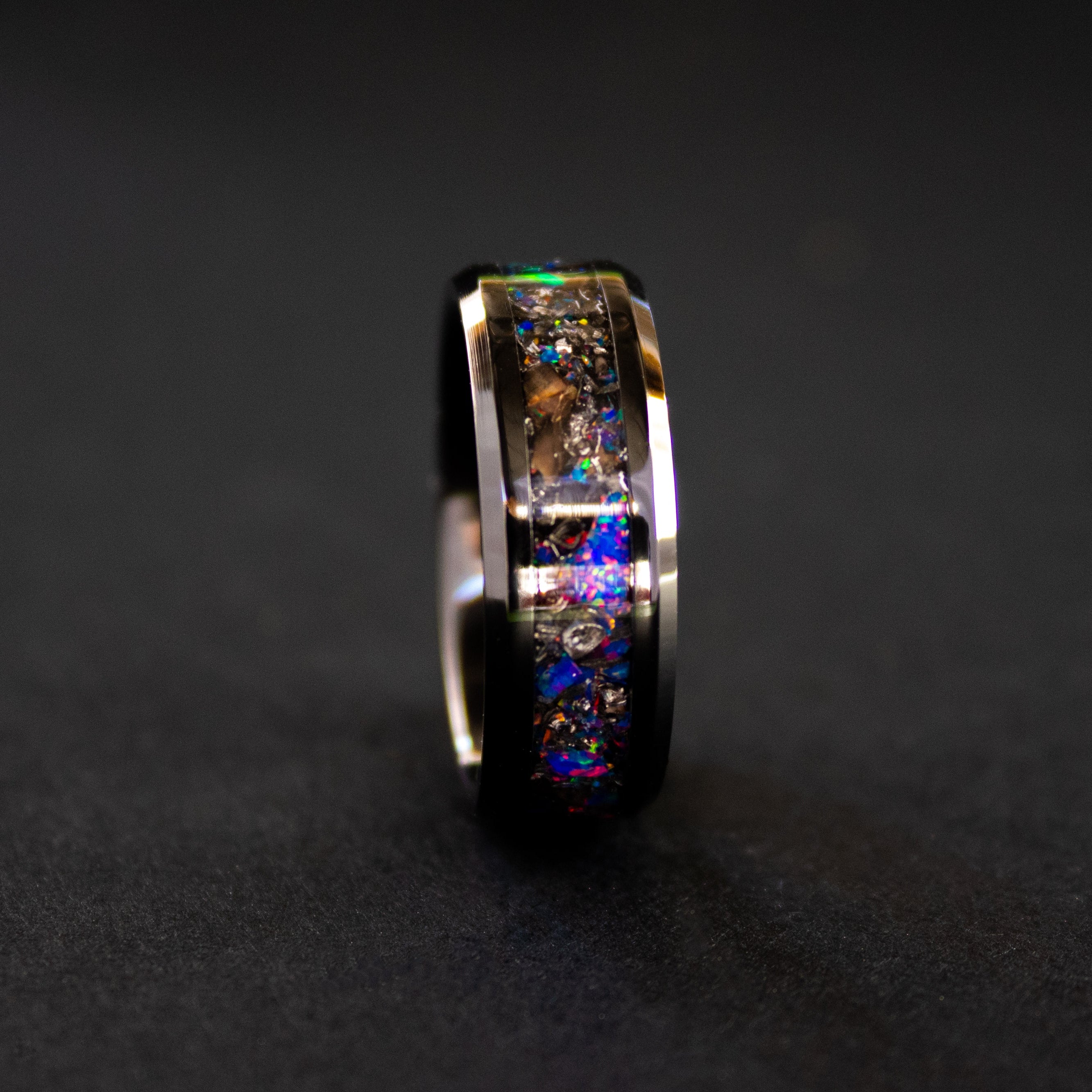 8mm beveled black ceramic ring with authentic T-Rex bone and Campo del Cielo meteorite in midnight blue purple opal inlay