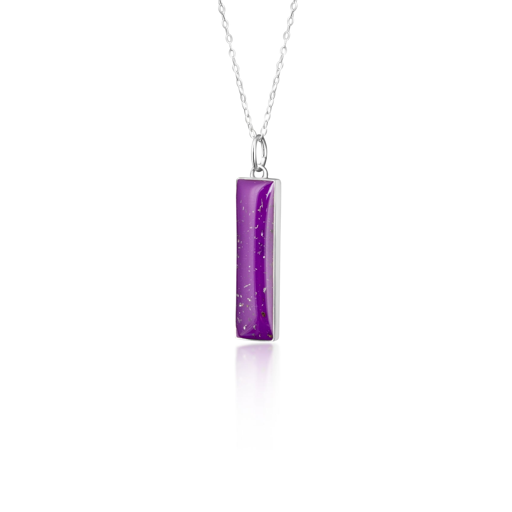 Close-up of the Plum Bar pendant showing authentic Campo Del Cielo meteorite fragments set in purple resin