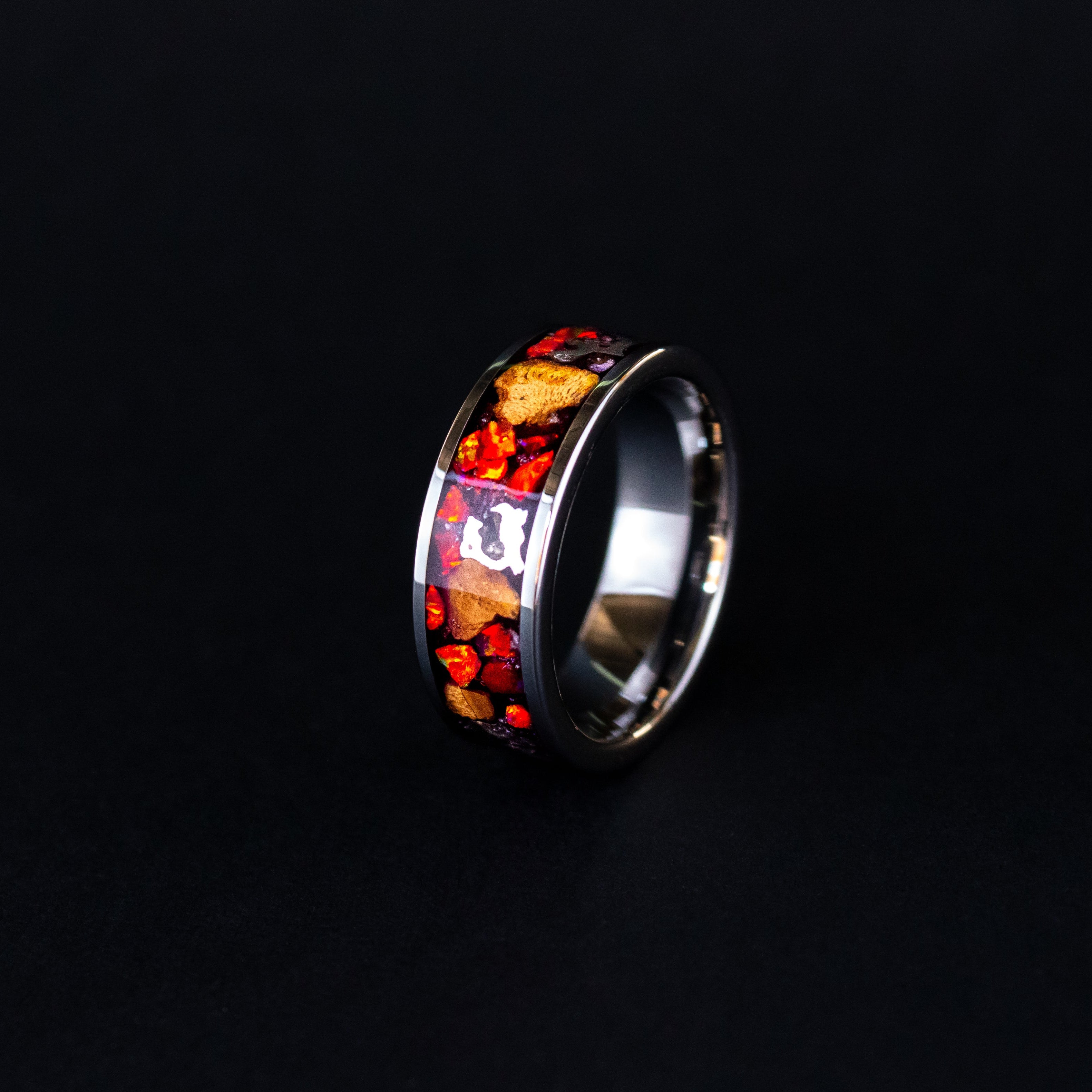 8mm wide channel tungsten ring with large pieces of authentic Triceratops bone and Campo del Cielo meteorite in red opal inlay