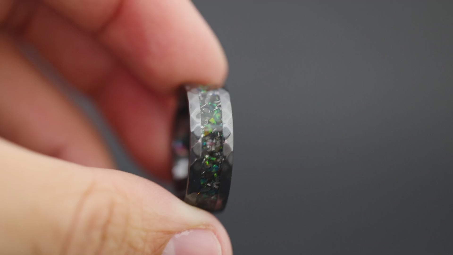 Cinematic view of the Deep Sea Predator ring showing the green opal glow and hammered texture.