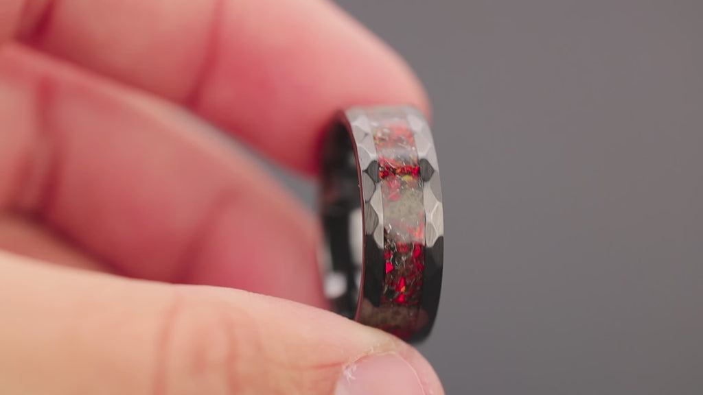 360 degree product view of the Martian Trex Red ring showing T-Rex bone and Martian meteorite shifting through red opal inlay on hammered black ceramic band