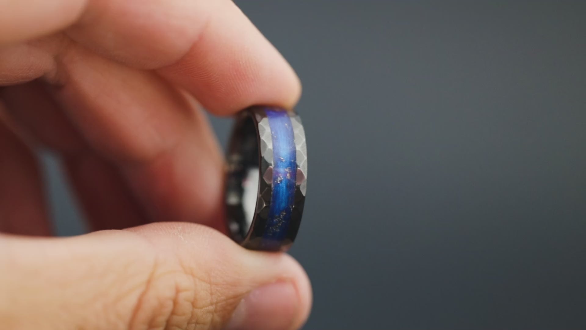 Cinematic view of the Blue Nebula Hammered ring showing the meteorite sparkle and blue resin.