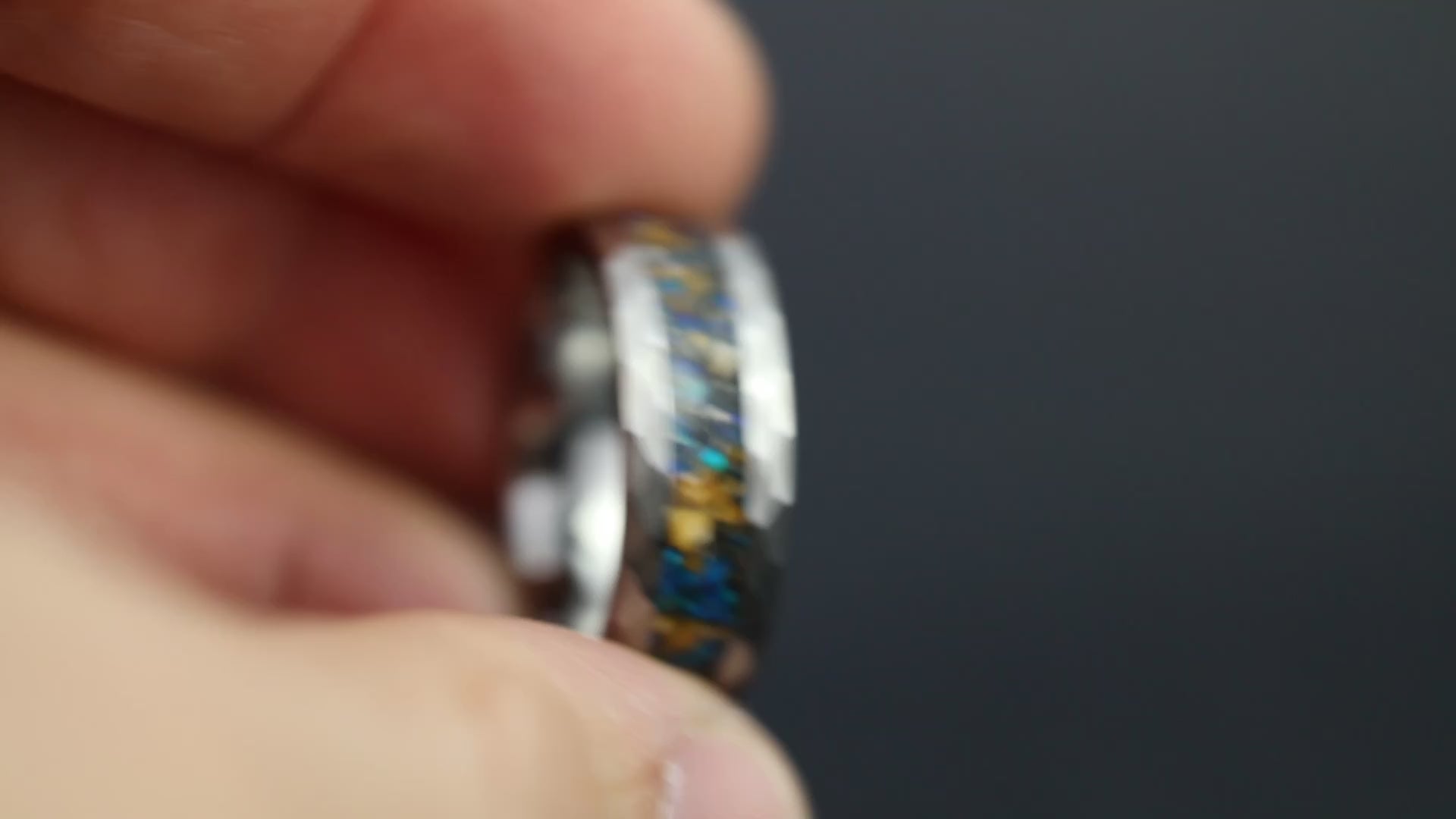 Cinematic view of the Cobalt Raptor Tungsten ring showing the blue opal glow and hammered texture.