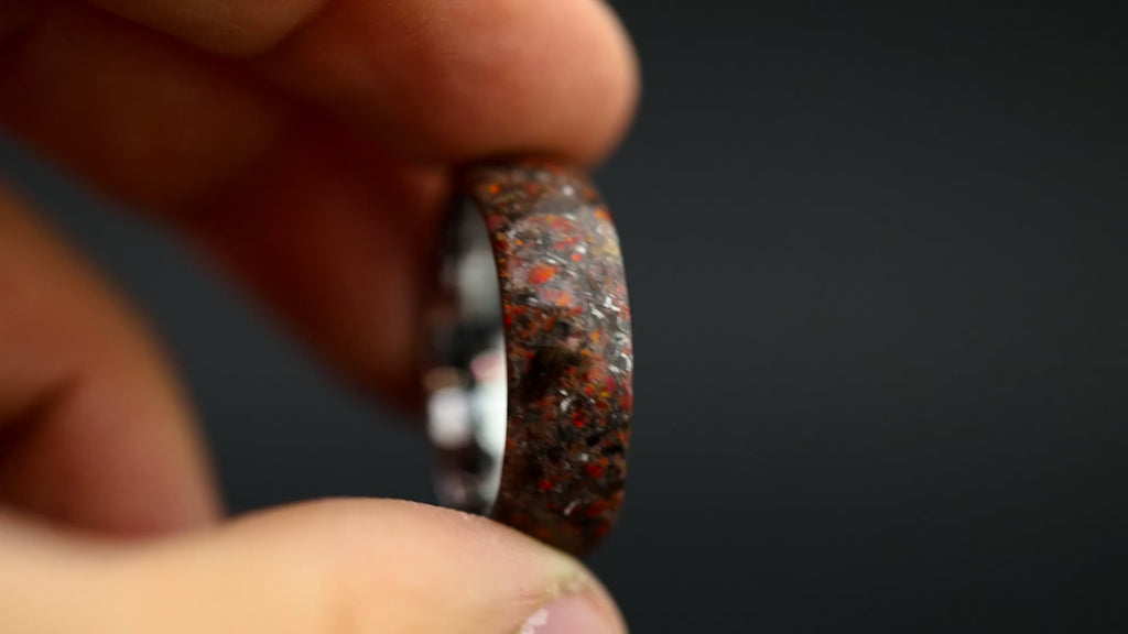 Cinematic view of the Endless Red Rex ring showing the transition from daylight to the red glow-in-the-dark effect.
