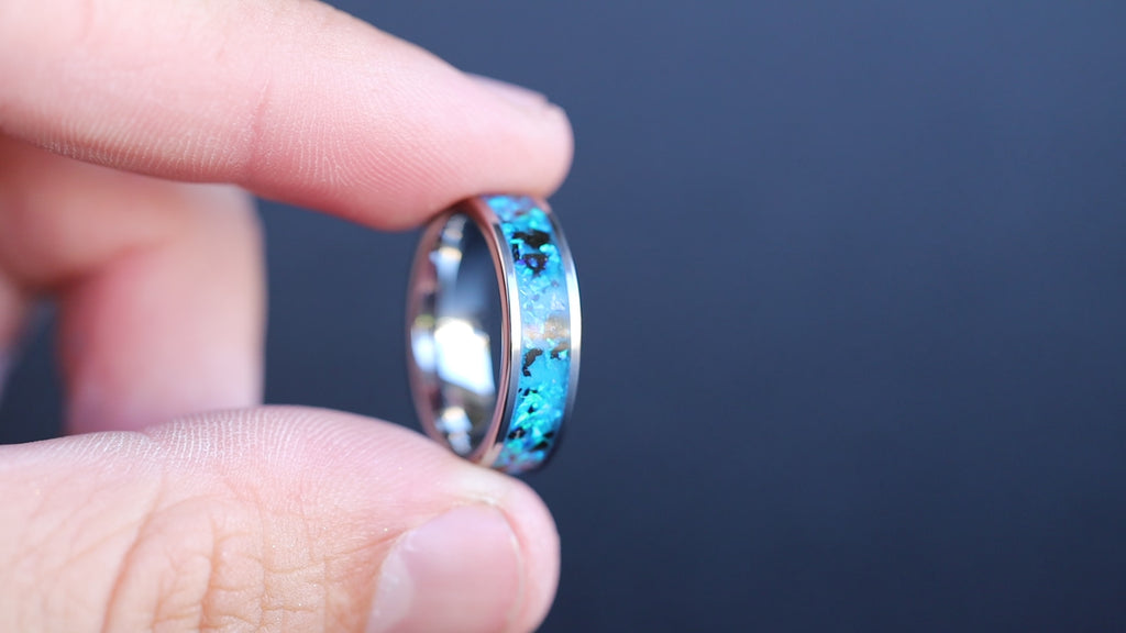 360 degree product view of the Blue Megalodon Abyss ring showing Megalodon shark tooth fossil and blue opal inlay transitioning to blue glow in the dark