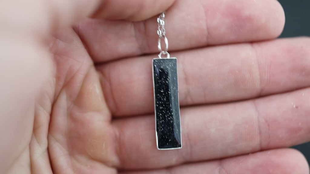 Video of the Eclipse Bar pendant necklace in sterling silver featuring Campo Del Cielo meteorite and black resin inlay