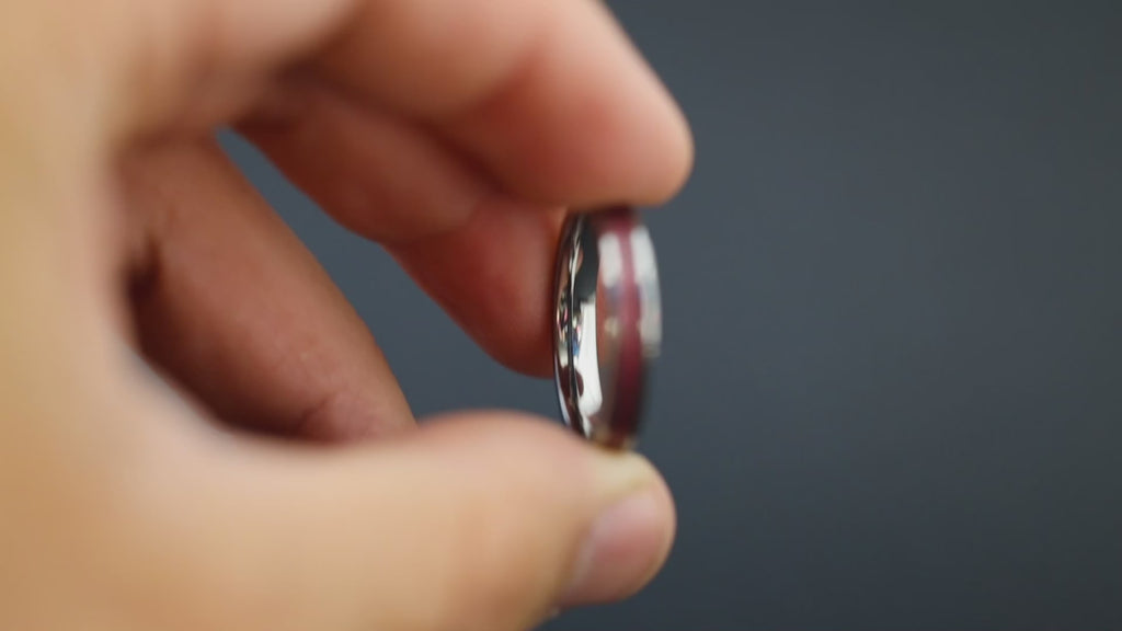 Cinematic view of the Stellar Rose ring showing the meteorite sparkle and metallic resin.