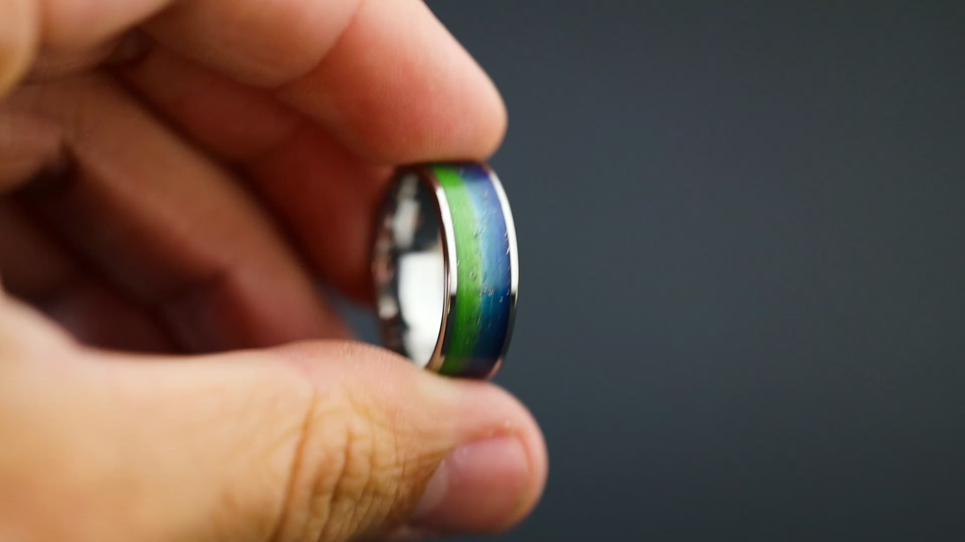 Cinematic view of the Ocean Gibeon ring showing the Gibeon meteorite sparkle and split resin colors.