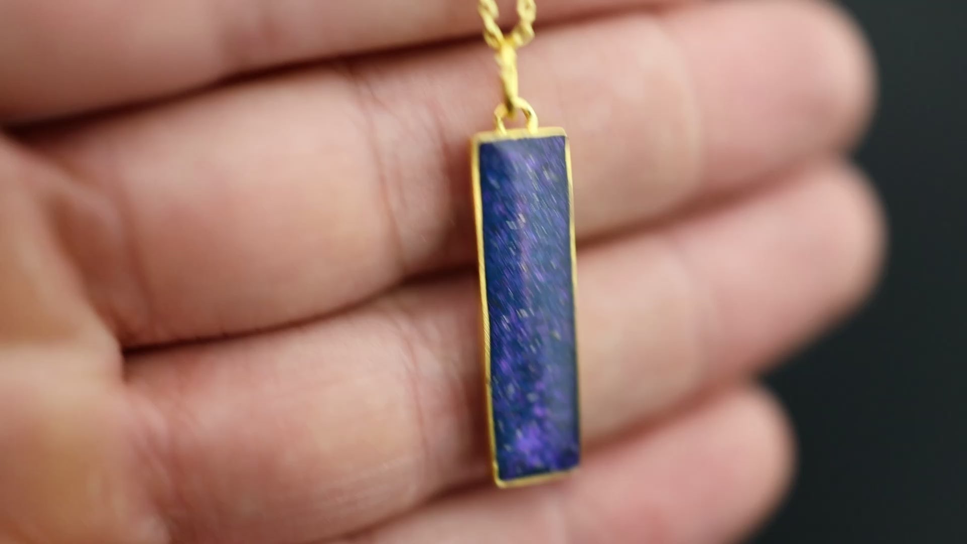 Video of the Midnight Gold Bar pendant necklace in gold-plated sterling silver featuring Campo Del Cielo meteorite and blue and purple pigment glitter inlay