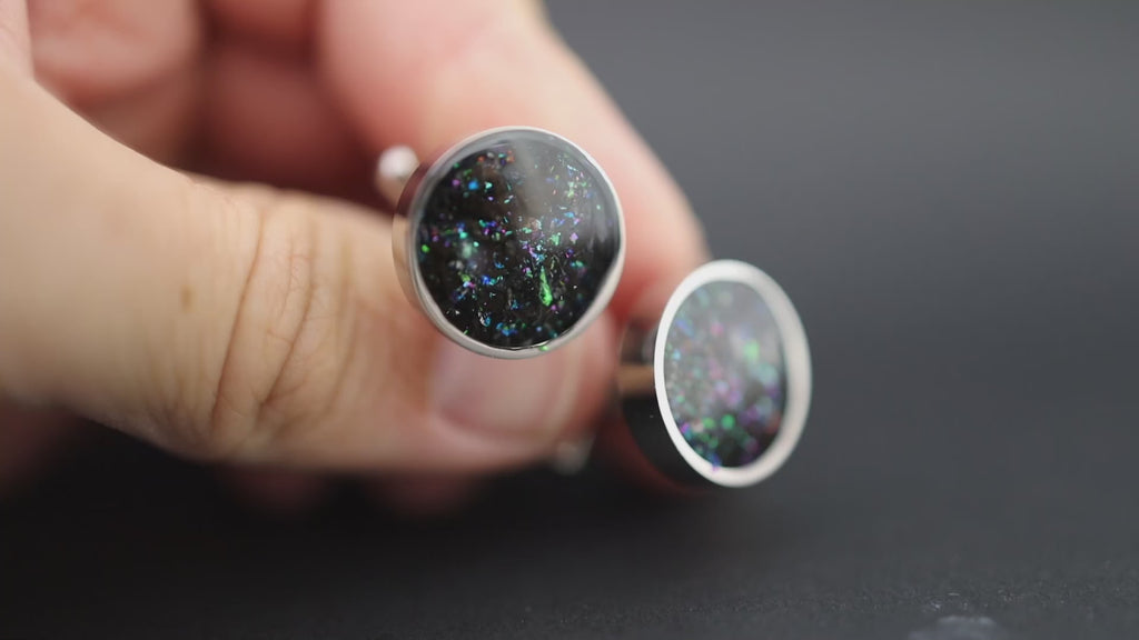 Video of the Deep Sea Megalodon Cufflinks handcrafted silver-tone stainless steel mens cufflinks featuring real megalodon tooth, Campo Del Cielo meteorite, and a deep sea blend of blue, green, and multicolored glitter
