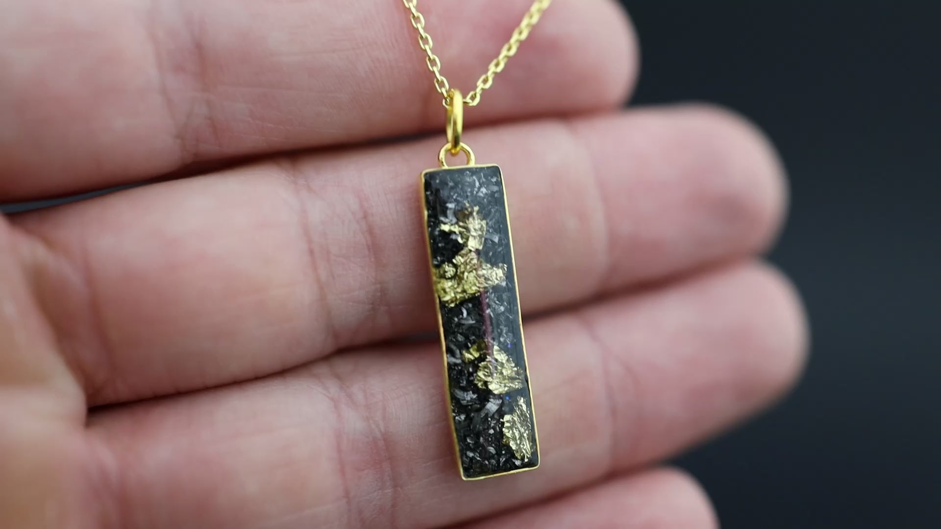 Video of the Bullion Bar pendant necklace in gold-plated sterling silver featuring Campo Del Cielo meteorite and 24K gold flake inlay