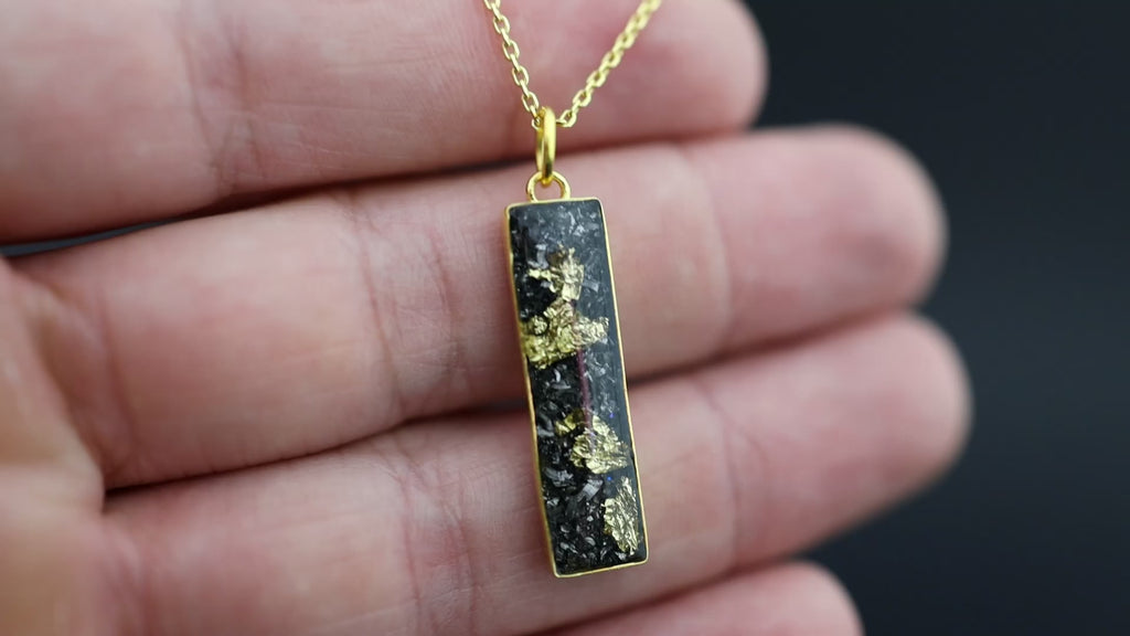 Video of the Bullion Bar pendant necklace in gold-plated sterling silver featuring Campo Del Cielo meteorite and 24K gold flake inlay