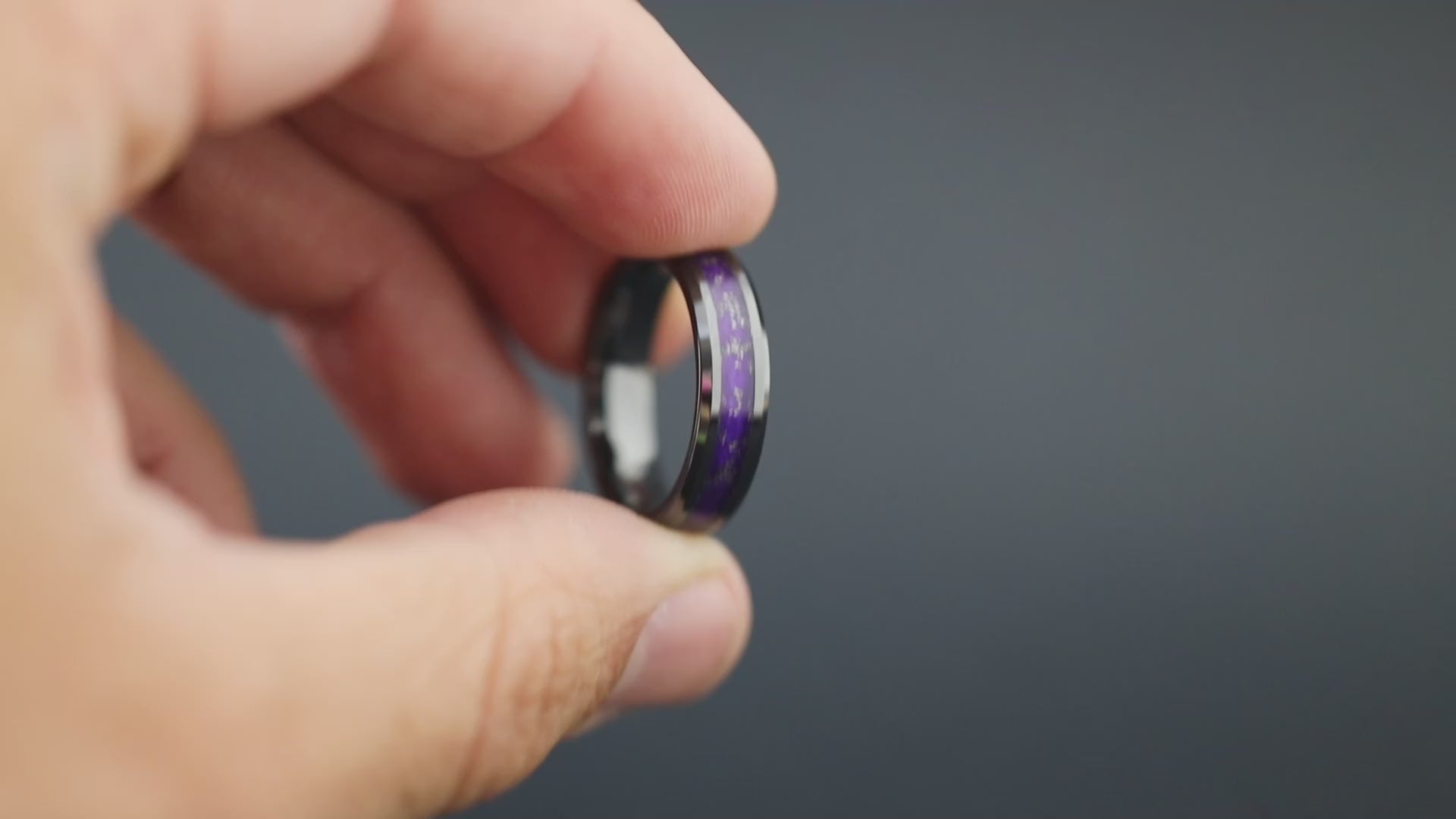 Cinematic view of the Purple Gibeon Galaxy ring showing the Gibeon meteorite sparkle and purple resin.