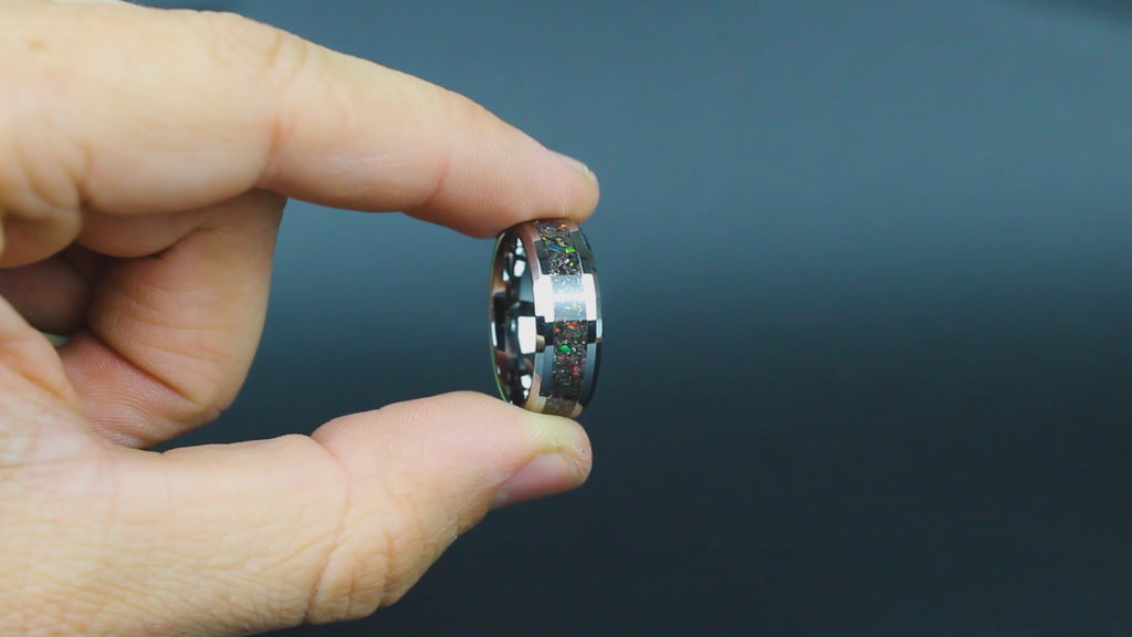 360 degree product view of the Shadow Fire ring showing Campo del Cielo meteorite shavings and black fire opal accents catching light on 8mm beveled tungsten band