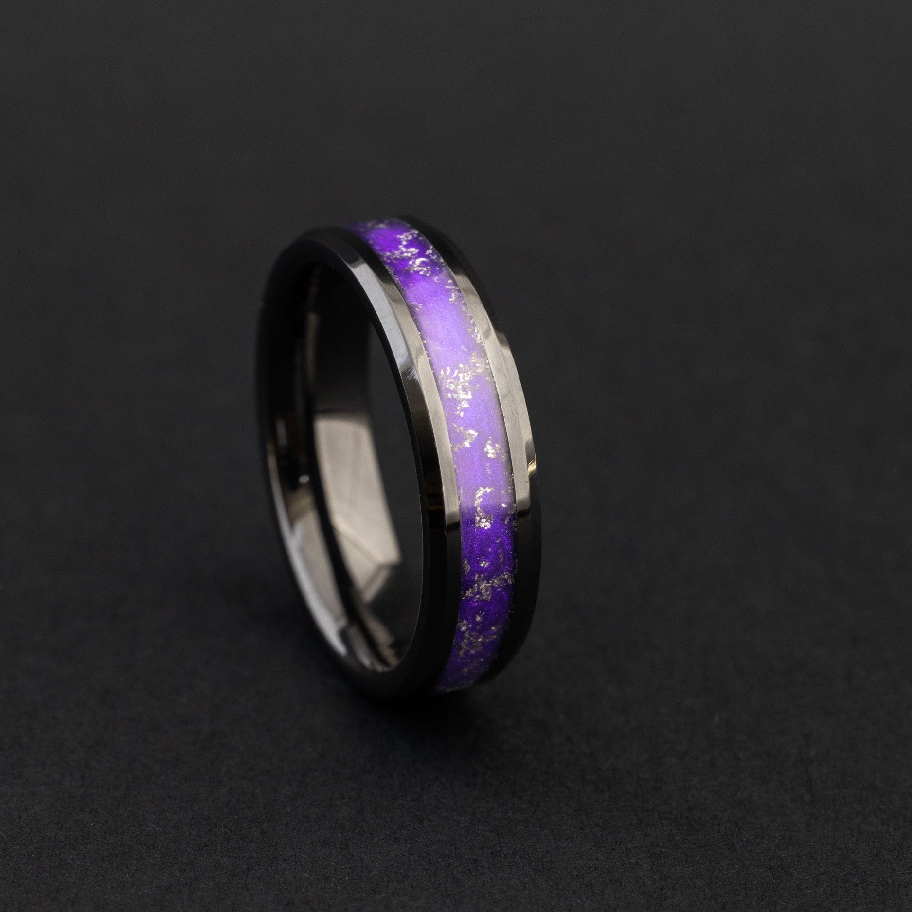 Close up of Gibeon meteorite shavings in a vibrant purple 6mm beveled ceramic ring.